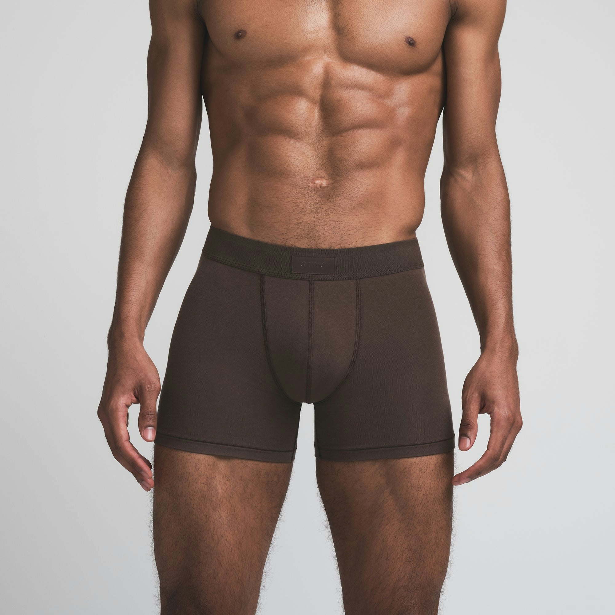SKIMS COTTON MENS 3 INCH BOXER BRIEF | DARK SEPIA ON A MODEL FRONT VIEW | FOCUS: 0.0, 1.0, 0.9