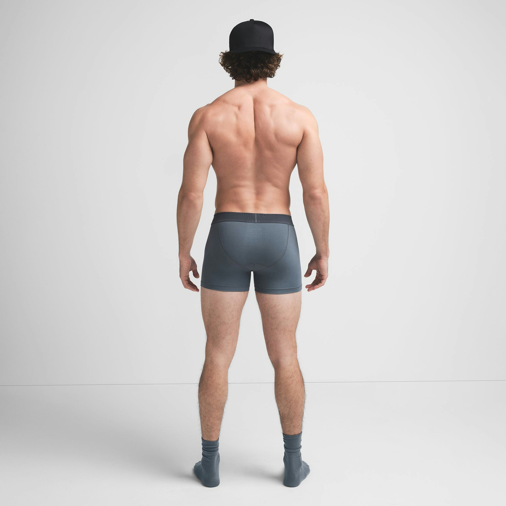 SKIMS COTTON MENS 3" BOXER BRIEF | KYANITE ON A MODEL BACK VIEW @ | FOCUS: 0.9, 0.1, 0.7