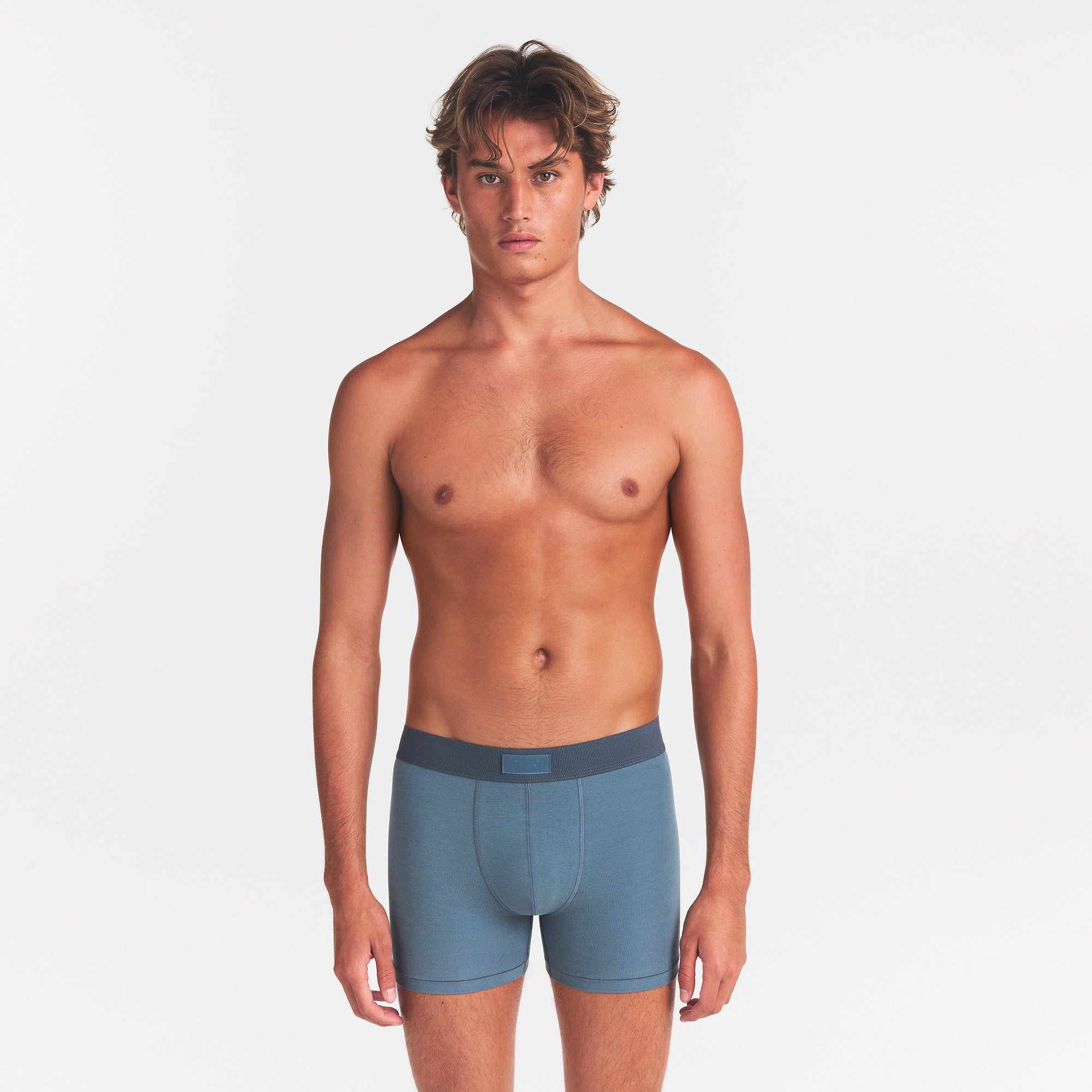 SKIMS COTTON MENS 3" BOXER BRIEF | KYANITE ON A MODEL FRONT VIEW