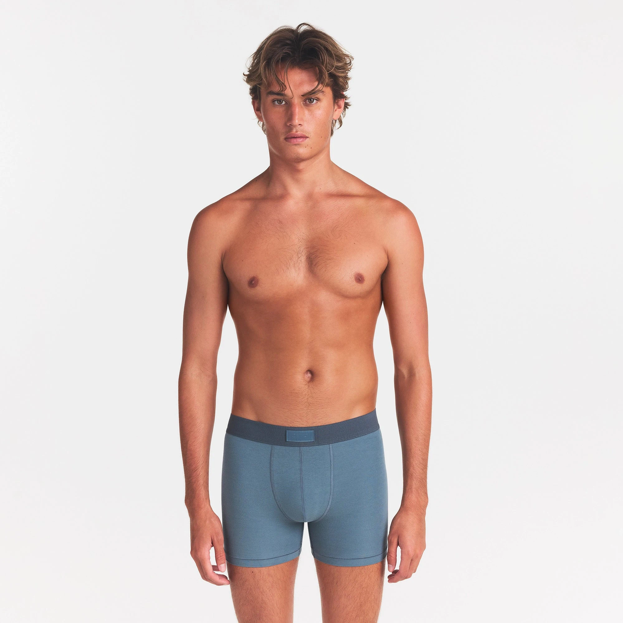 SKIMS COTTON MENS 3" BOXER BRIEF | KYANITE ON A MODEL FRONT VIEW