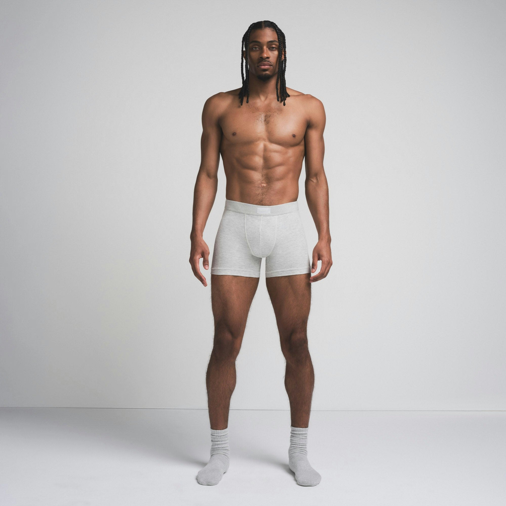 SKIMS COTTON MENS 3" BOXER BRIEF | LIGHT HEATHER GREY ON A MODEL FRONT VIEW @ | FOCUS: 0.9, 0.1, 0.7