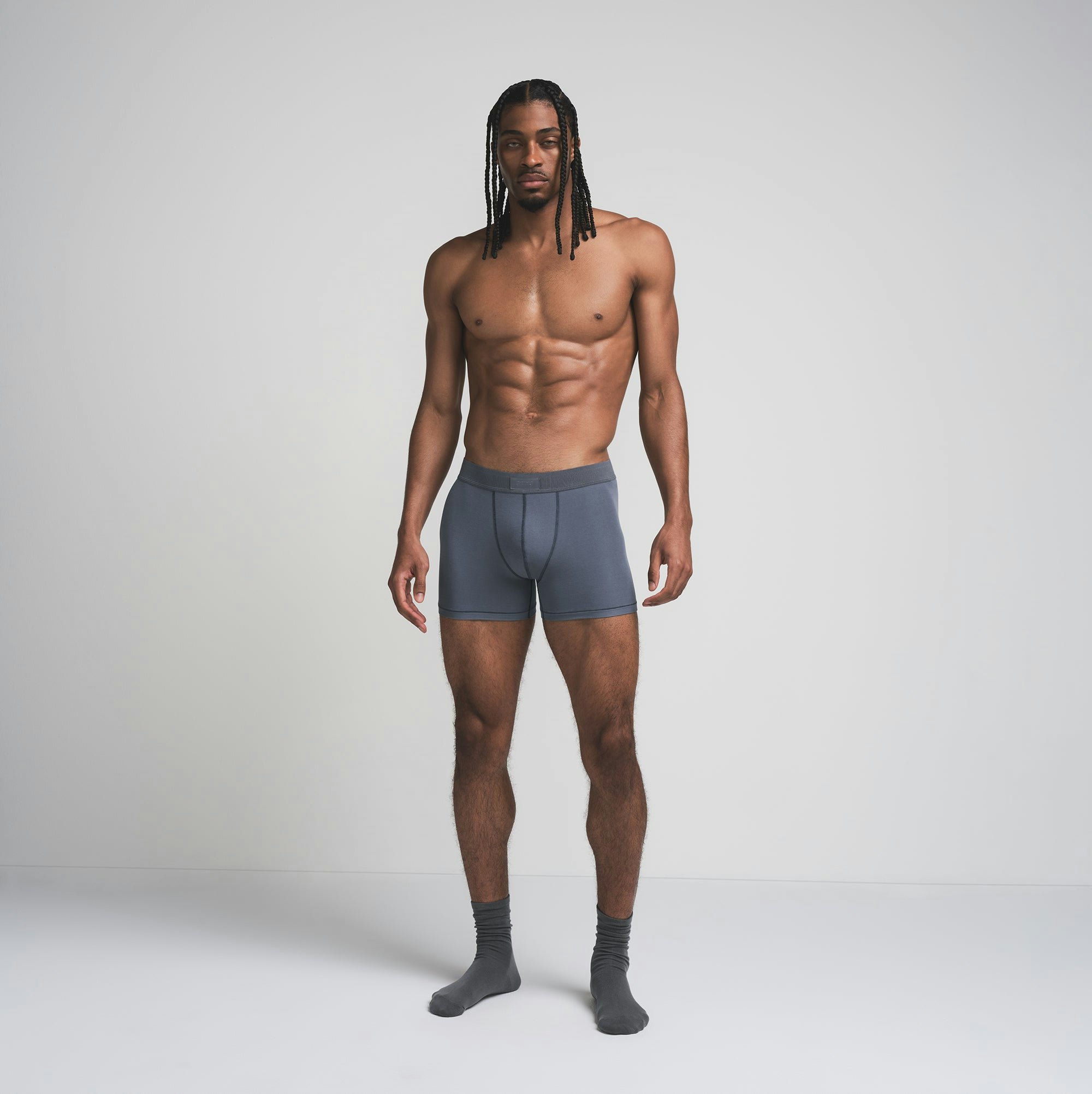 SKIMS COTTON MENS 3 INCH BOXER BRIEF 3-PACK | DARK SEPIA MULTI ON A MODEL FRONT VIEW | FOCUS: 0.0, 1.0, 0.9