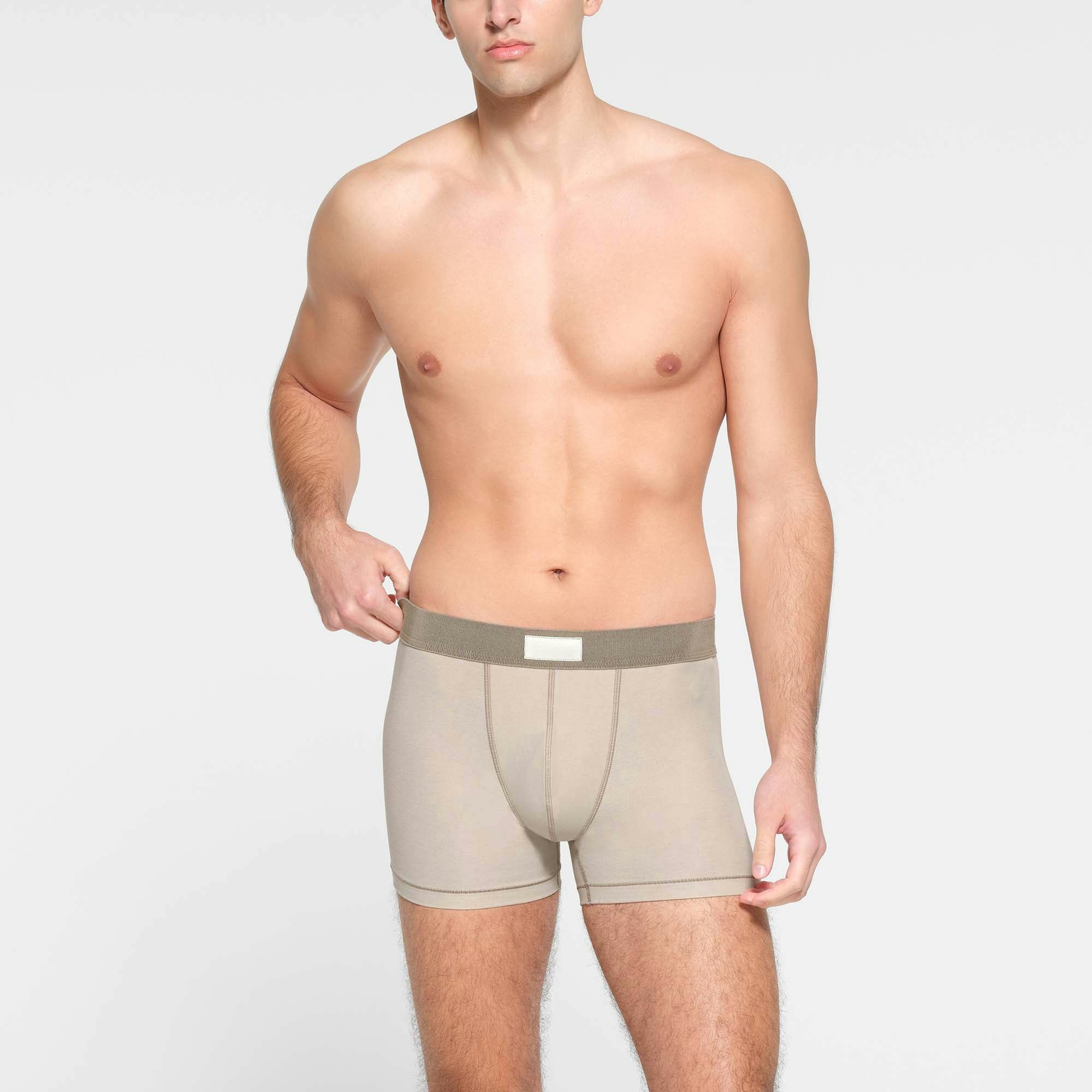 SKIMS COTTON MENS 3" BOXER BRIEF | STONE ON A MODEL FRONT VIEW