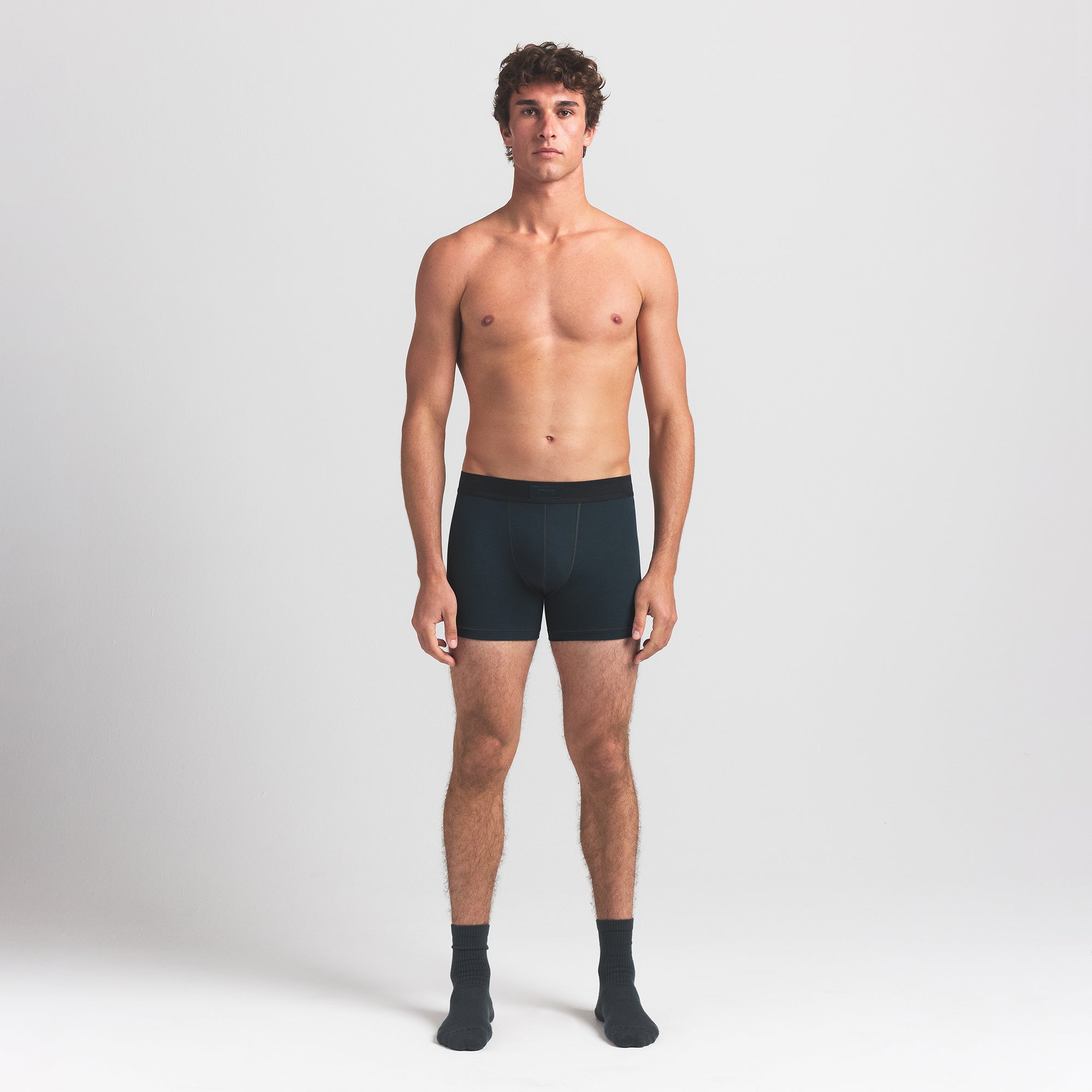 SKIMS COTTON MENS 3" BOXER BRIEF | VERDANT ON A MODEL FRONT VIEW @ | FOCUS: 0.0, 1.0, 0.9
