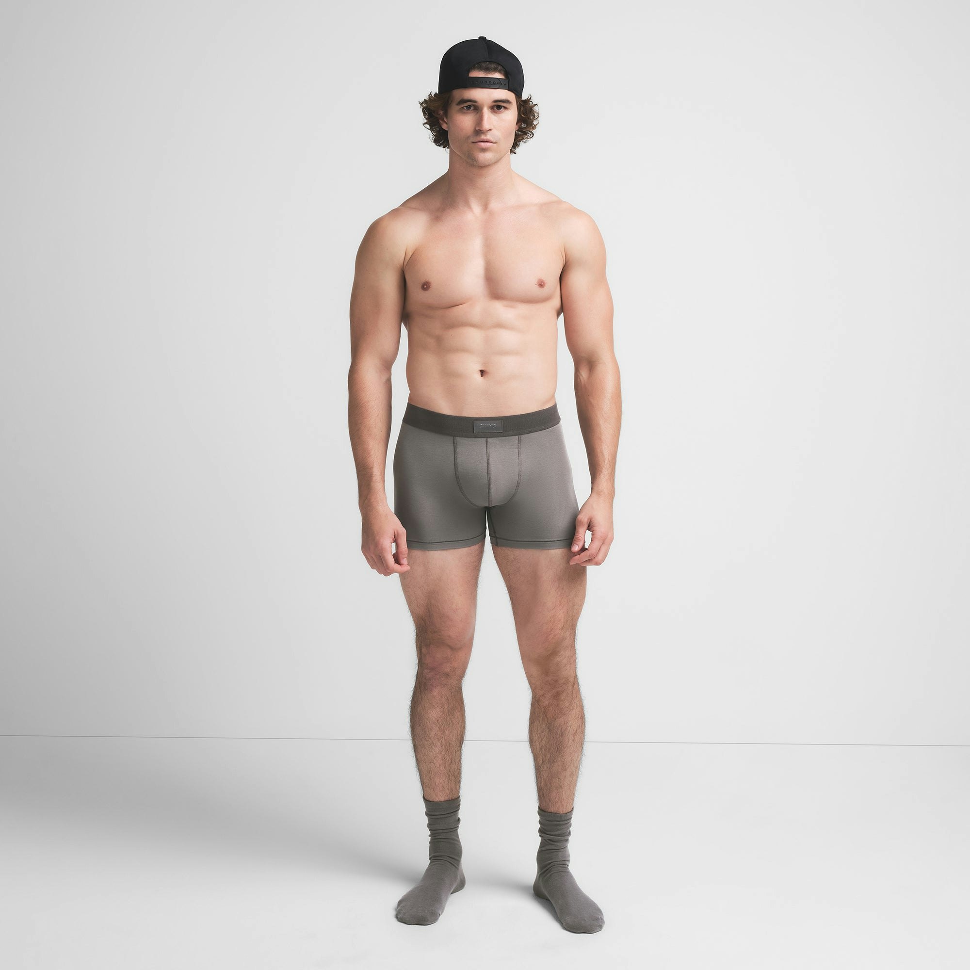 SKIMS COTTON MENS 3" BOXER BRIEF | WASHED GUNMETAL ON A MODEL FRONT VIEW @ | FOCUS: 0.9, 0.1, 0.7