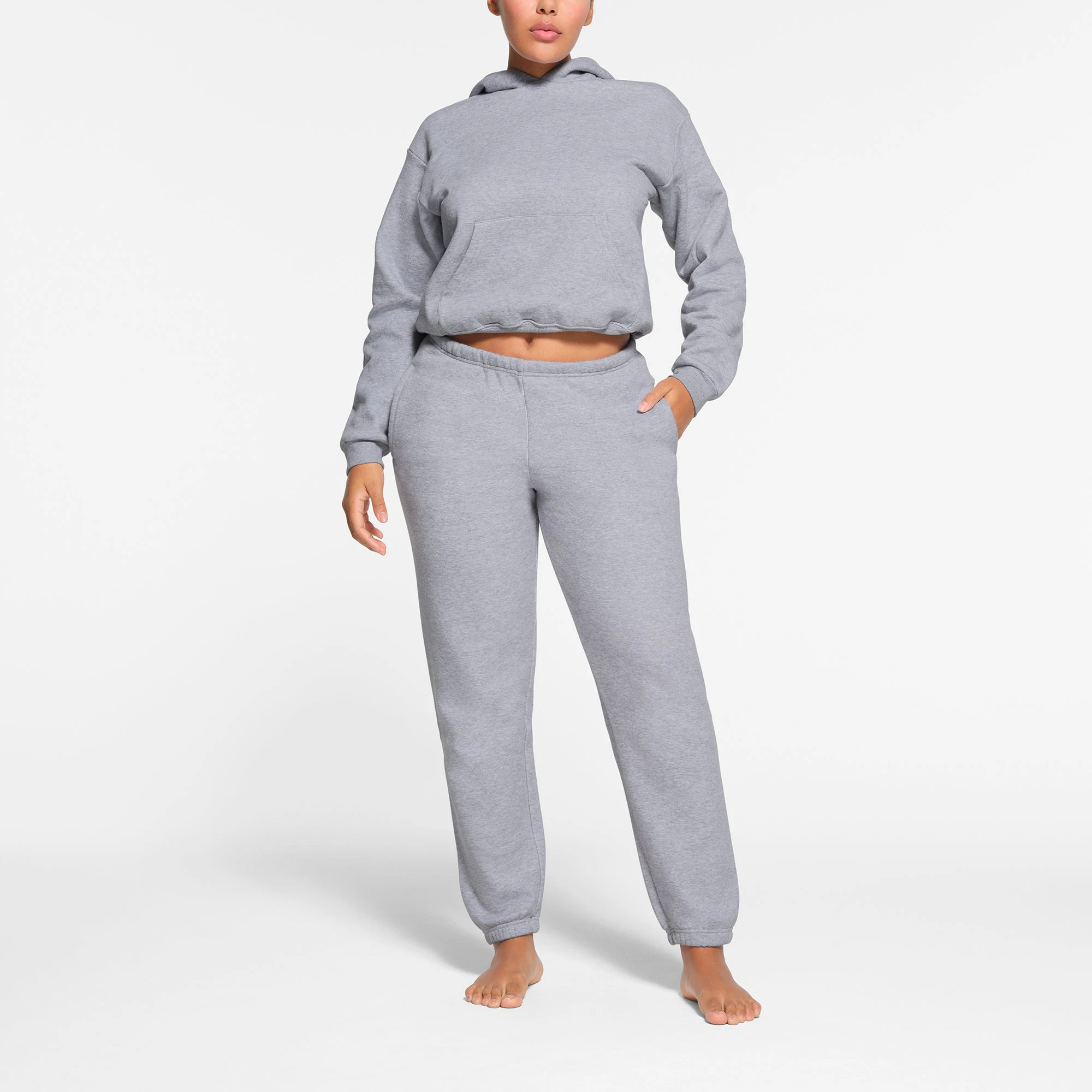 COTTON FLEECE CLASSIC JOGGER | HEATHER GREY ON A MODEL FRONT VIEW