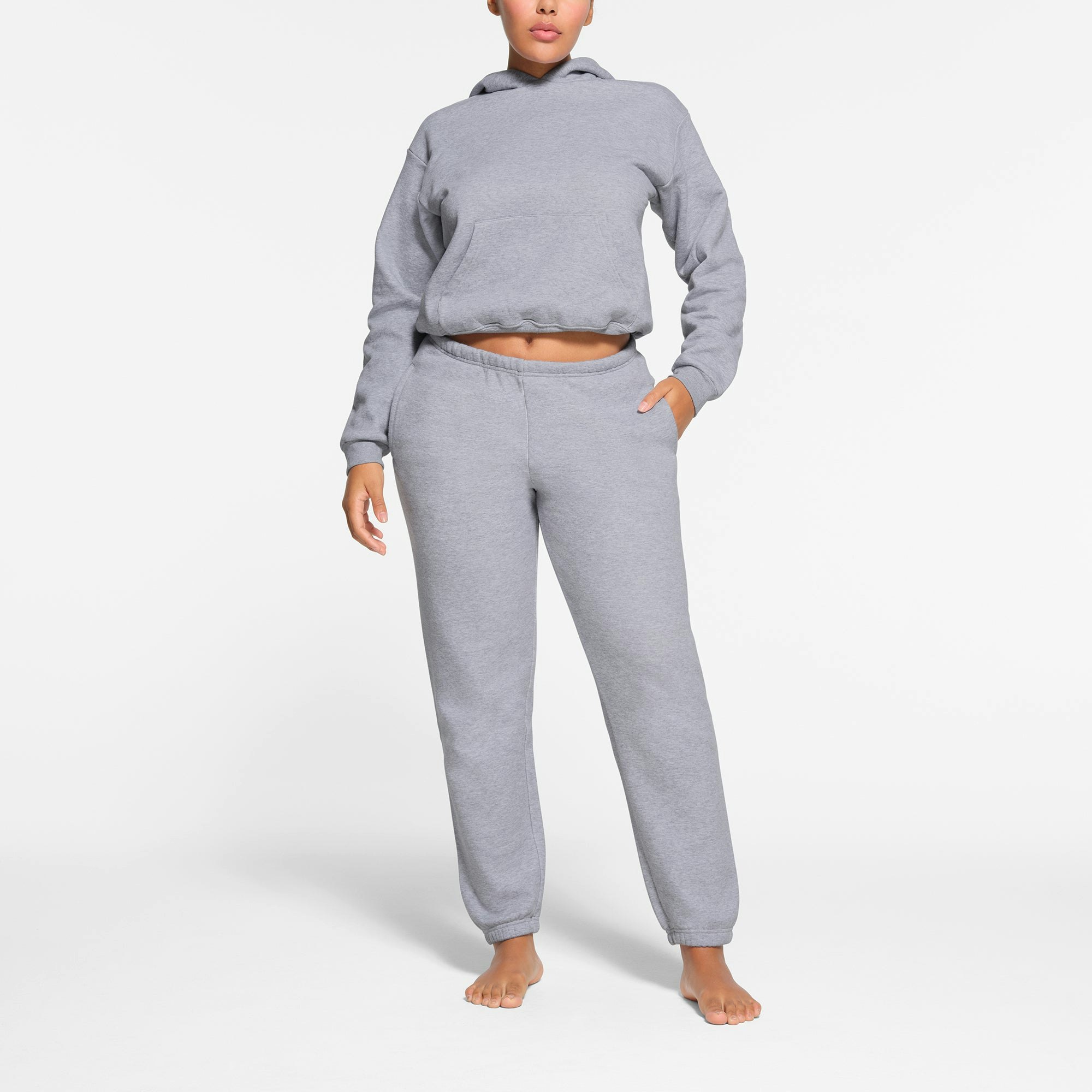 COTTON FLEECE CLASSIC JOGGER | HEATHER GREY ON A MODEL FRONT VIEW
