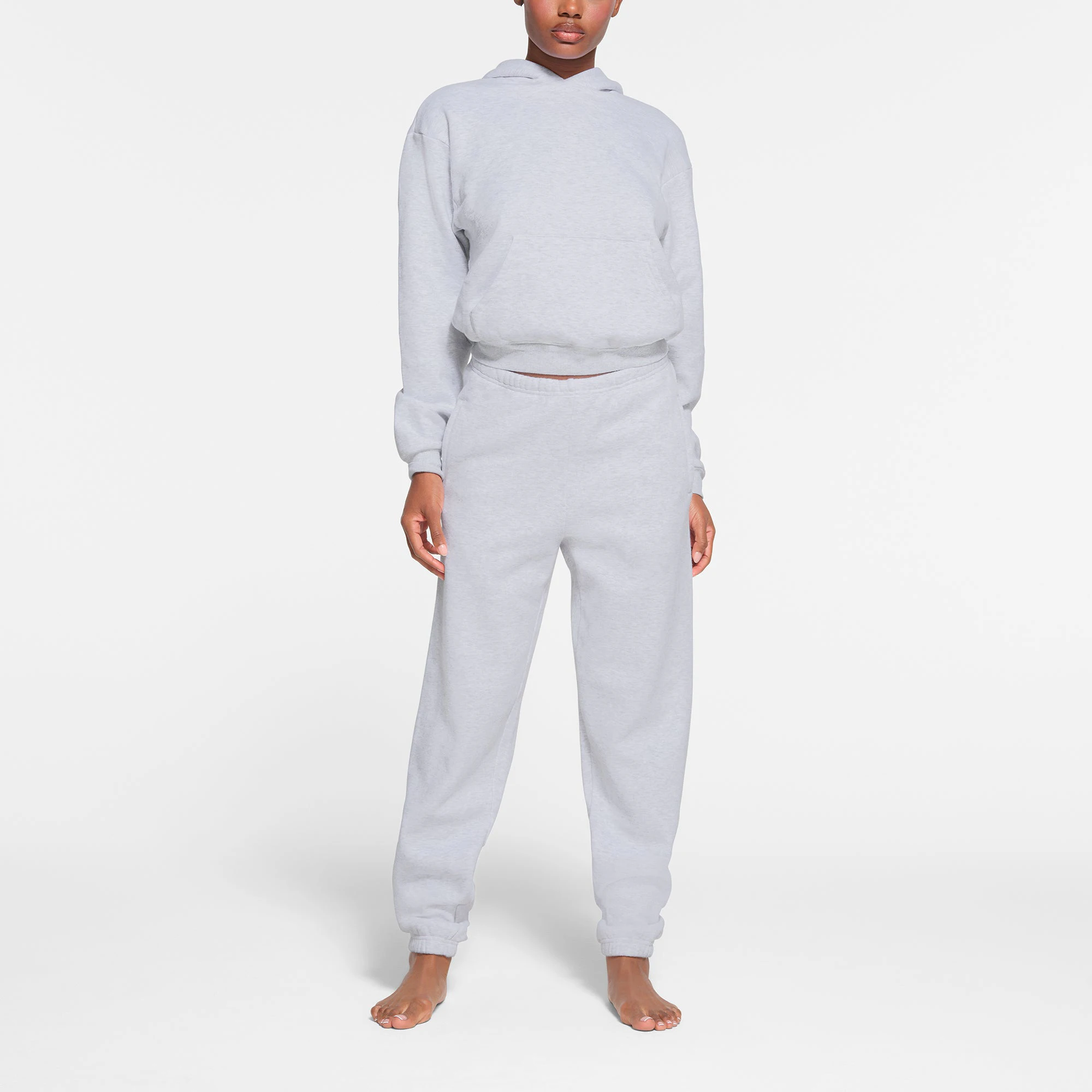 COTTON FLEECE CLASSIC JOGGER | LIGHT HEATHER GREY ON A MODEL FRONT VIEW