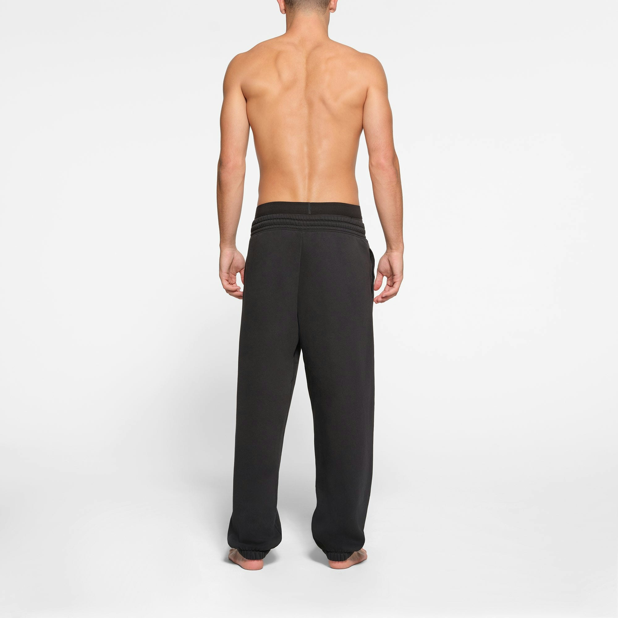 LOUNGE FLEECE MENS RELAXED JOGGER | WASHED ONYX ON A MODEL BACK VIEW