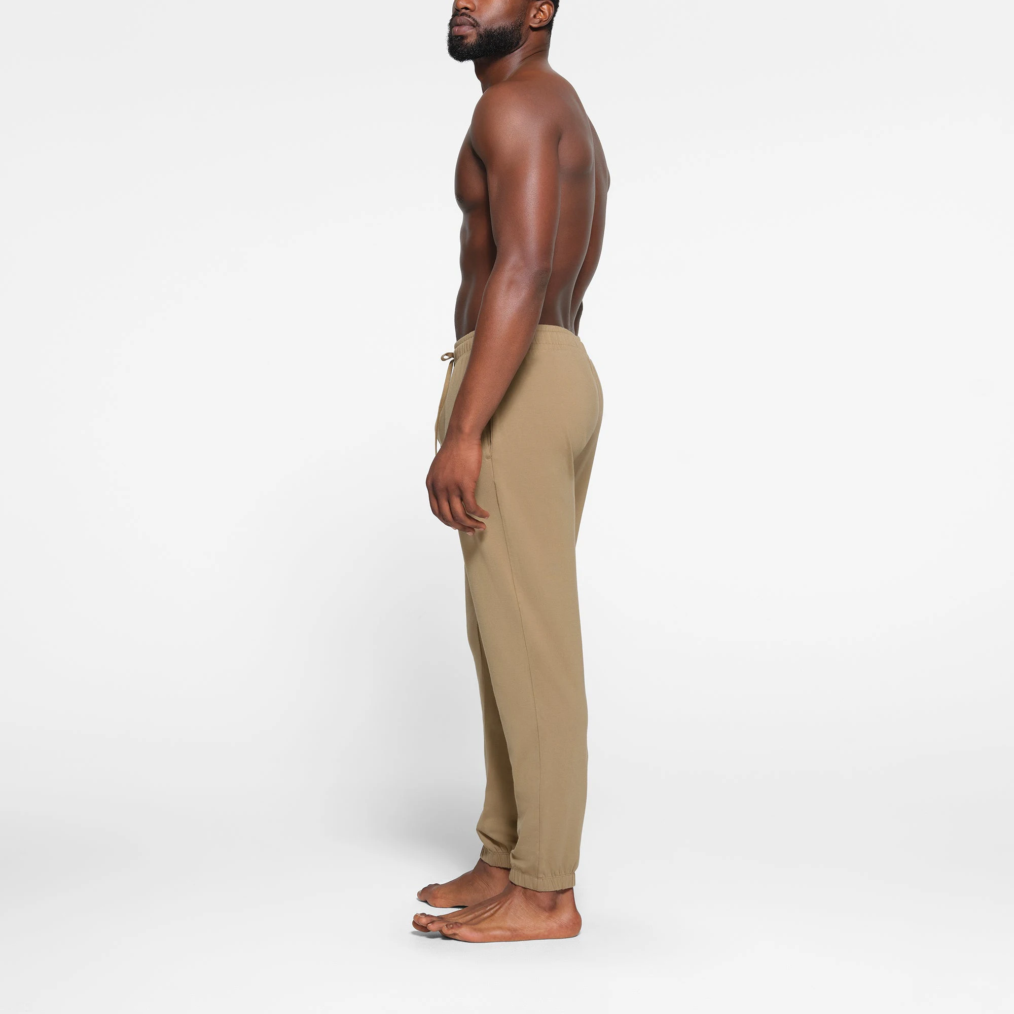LOUNGE JERSEY MENS JOGGER | KHAKI ON A MODEL SIDE VIEW