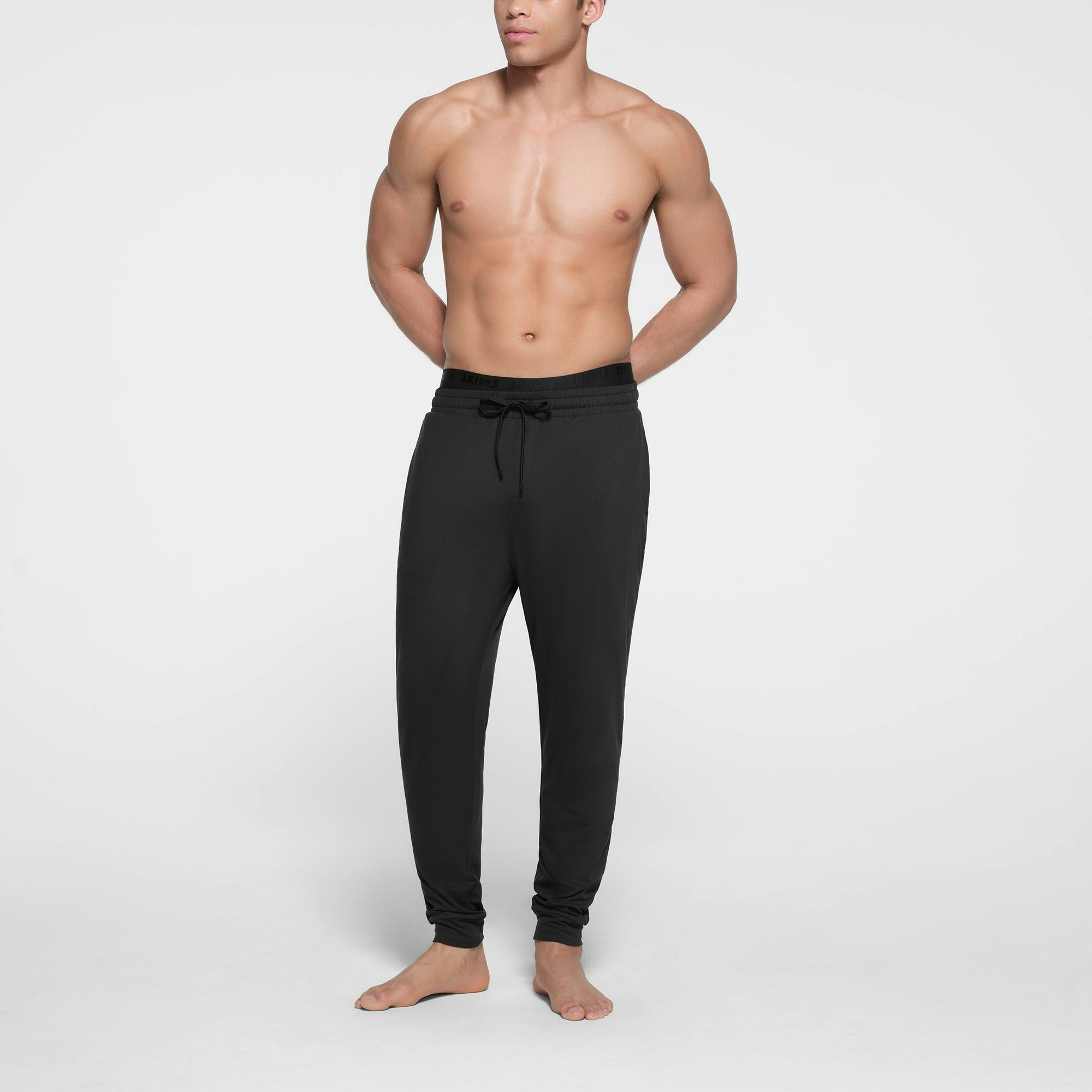 OUTDOOR JERSEY MENS TAPERED JOGGER | ONYX ON A MODEL FRONT VIEW @ | FOCUS: 0.9, 0.1, 0.7