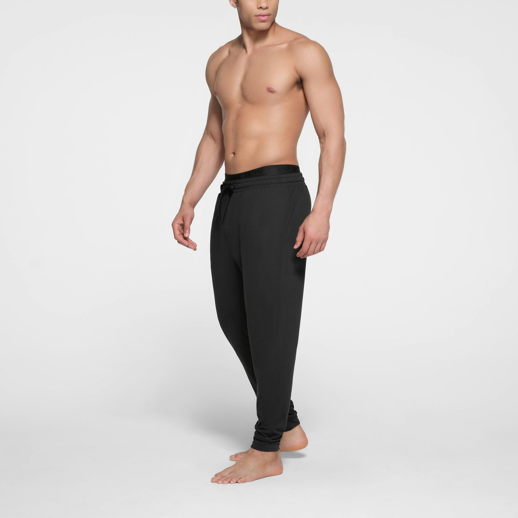 OUTDOOR JERSEY MENS TAPERED JOGGER | ONYX ON A MODEL SIDE VIEW @ | FOCUS: 0.9, 0.1, 0.7