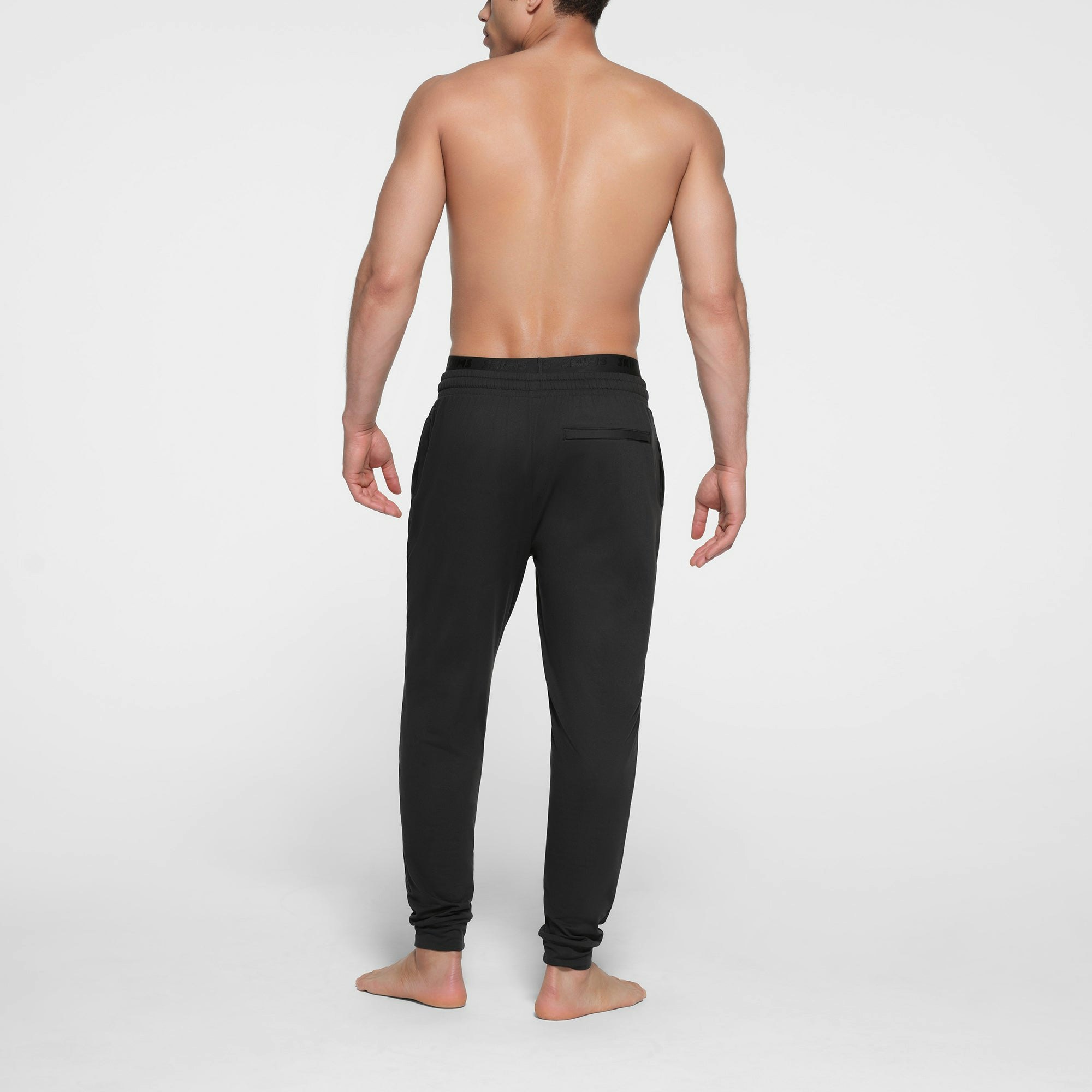 OUTDOOR JERSEY MENS TAPERED JOGGER | ONYX ON A MODEL BACK VIEW @ | FOCUS: 0.9, 0.1, 0.7