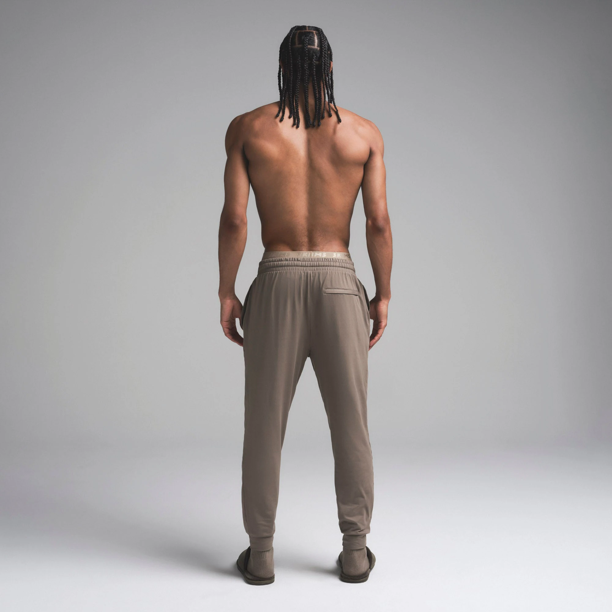 OUTDOOR JERSEY MENS TAPERED JOGGER | TRUFFLE ON A MODEL SIDE VIEW | FOCUS: 0.0, 1.0, 0.9