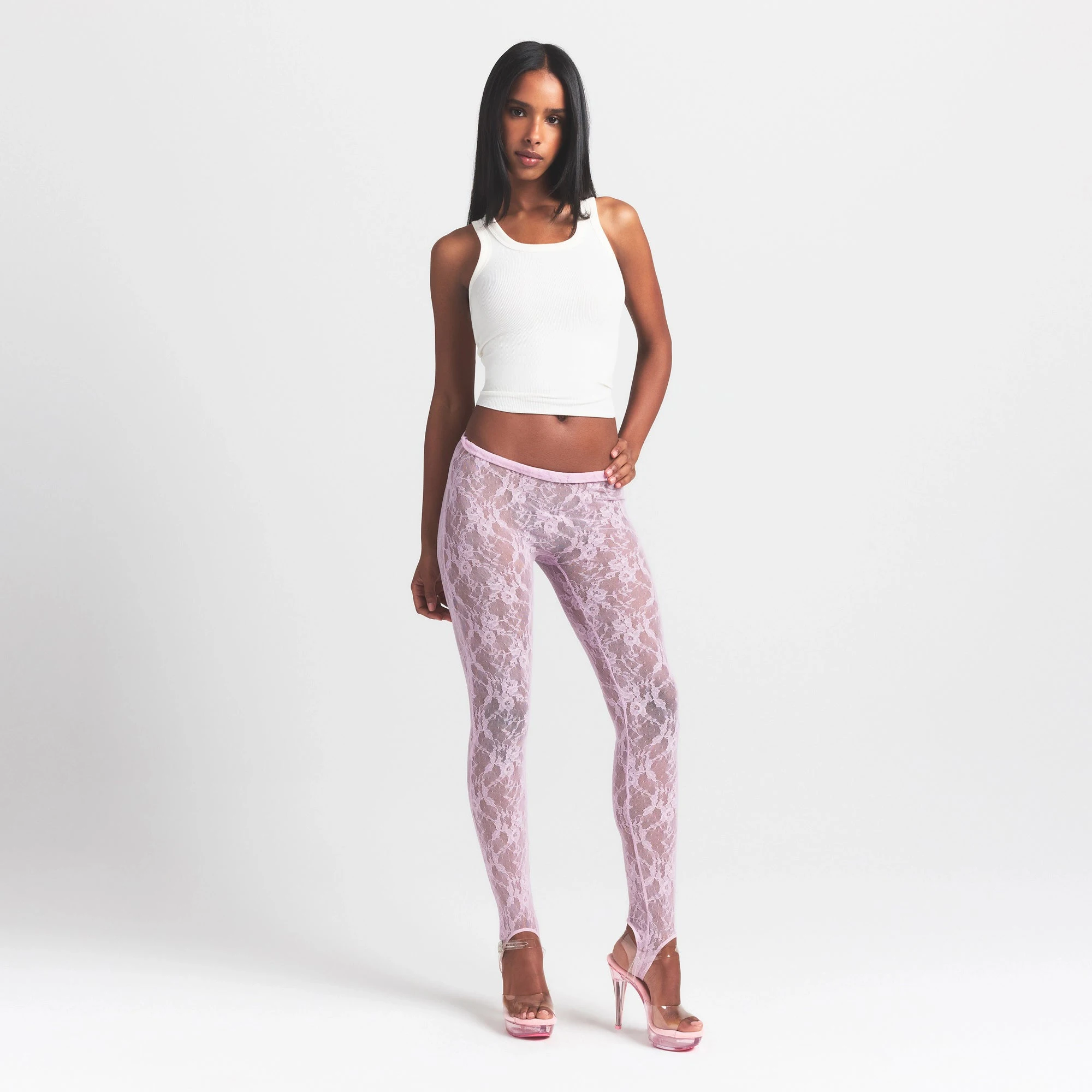STRETCH LACE STIRRUP LEGGING | BABY PINK ON A MODEL FRONT VIEW @ | FOCUS: 0.0, 1.0, 0.9