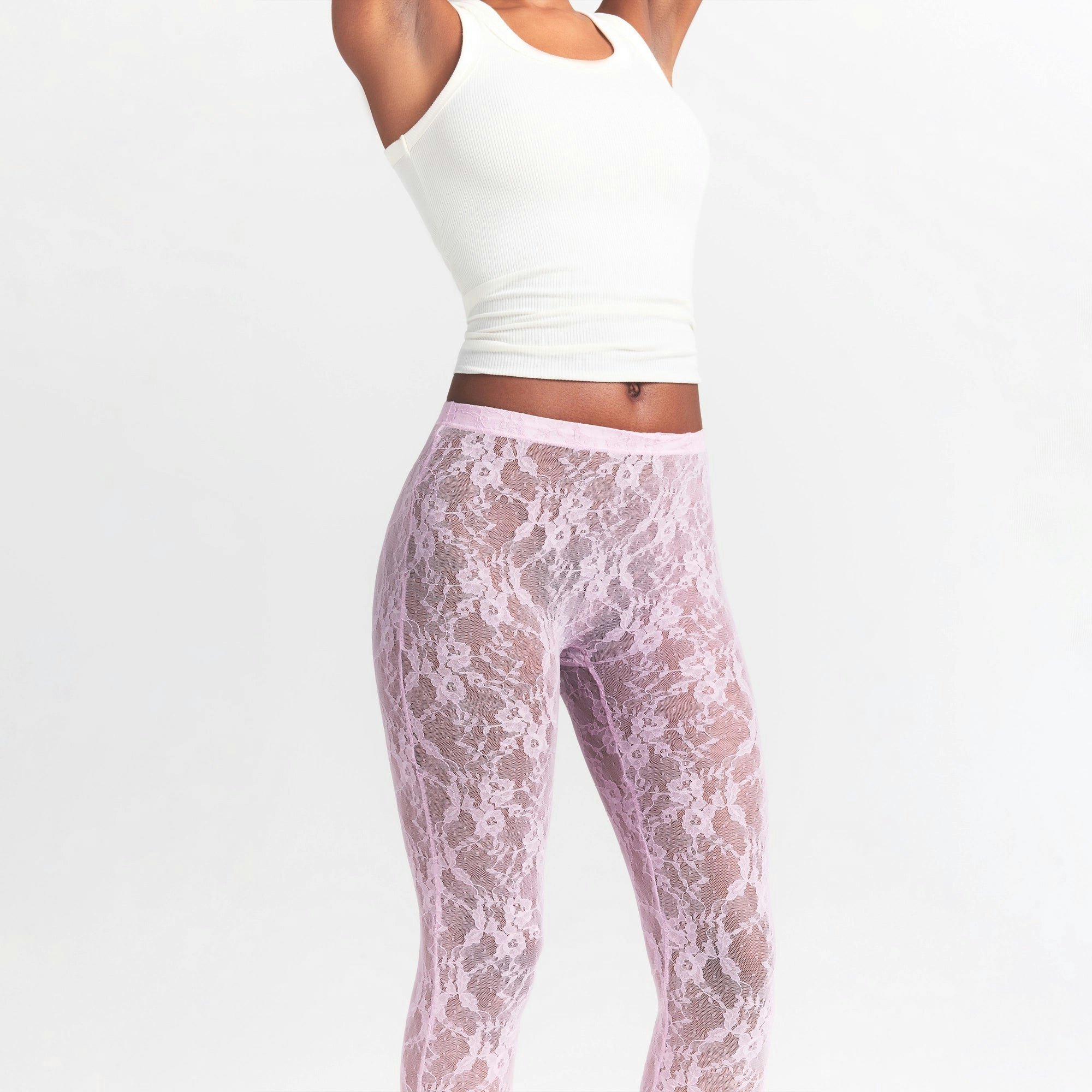 STRETCH LACE STIRRUP LEGGING | BABY PINK ON A MODEL SIDE VIEW @ | FOCUS: 0.0, 1.0, 0.9