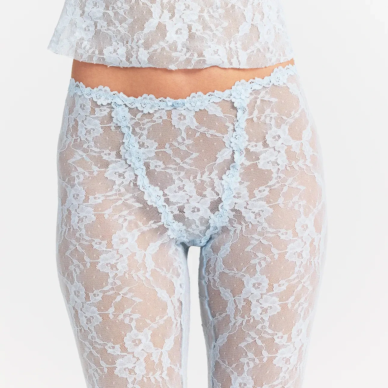 STRETCH LACE CAPRI | POWDER BLUE ON A MODEL FRONT VIEW @ | FOCUS: 0.0, 1.0, 0.9
