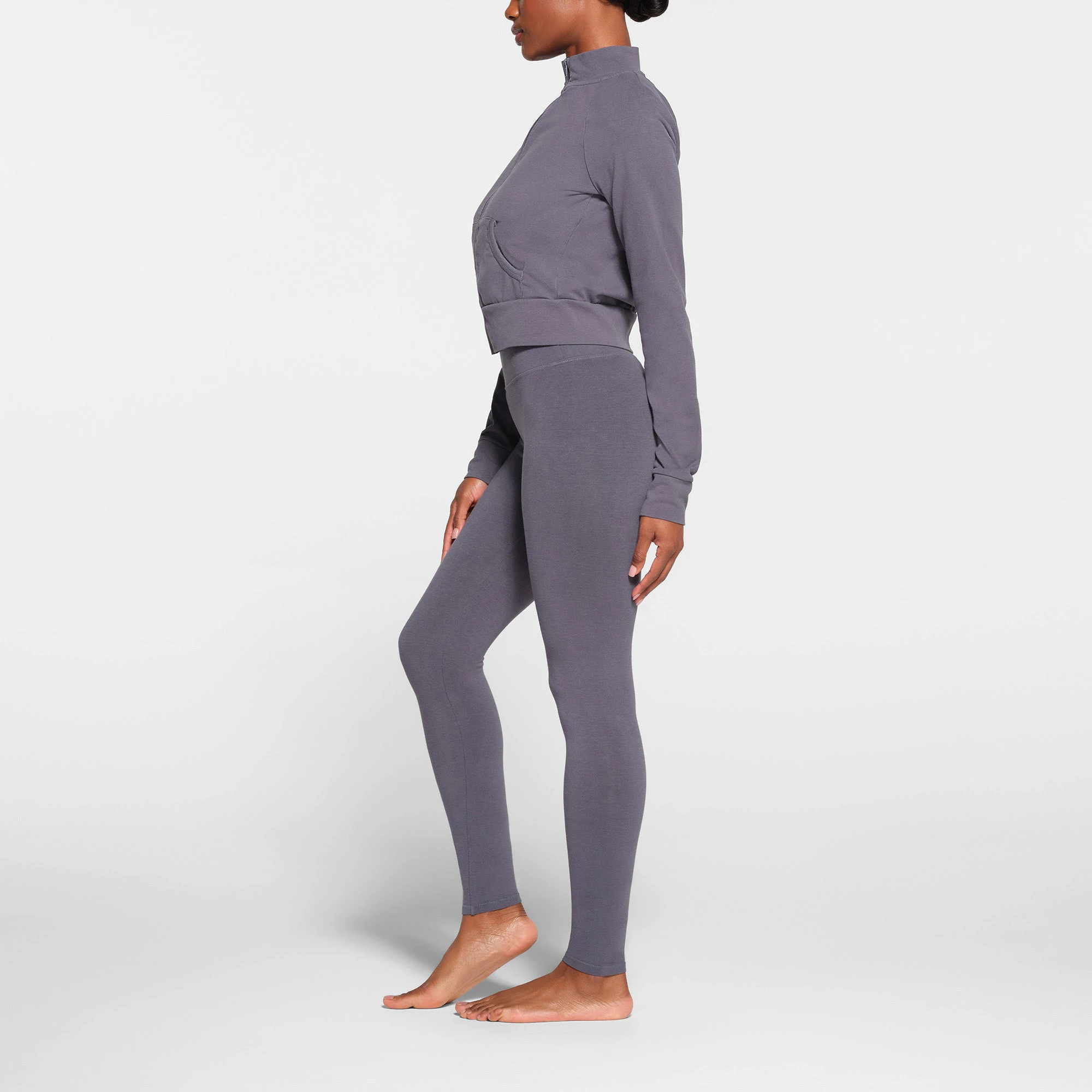 OUTDOOR HIGH-WAISTED LEGGING | STEEL BLUE ON A MODEL SIDE VIEW