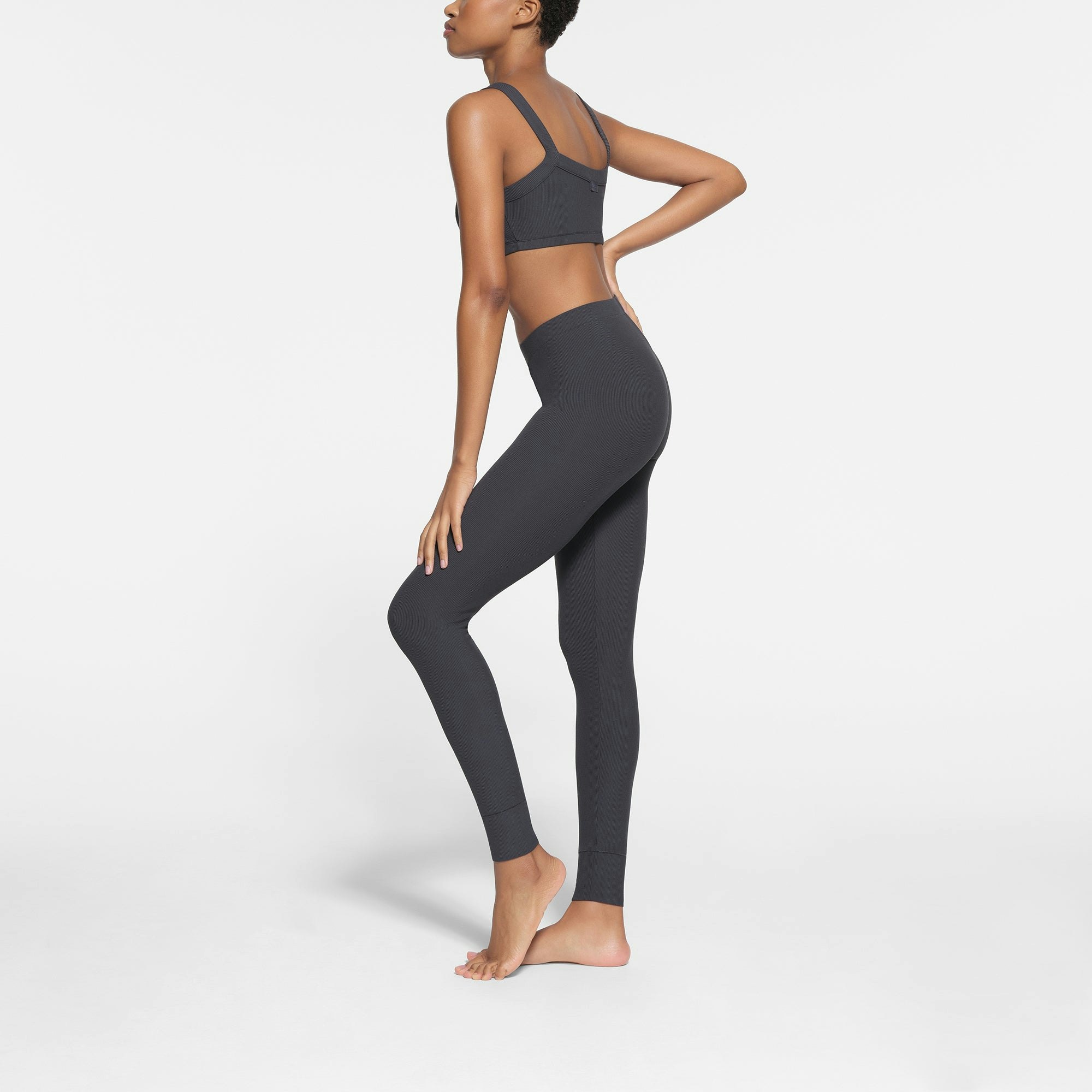 SOFT LOUNGE LEGGING WORN BY A MODEL IN SIDE VIEW