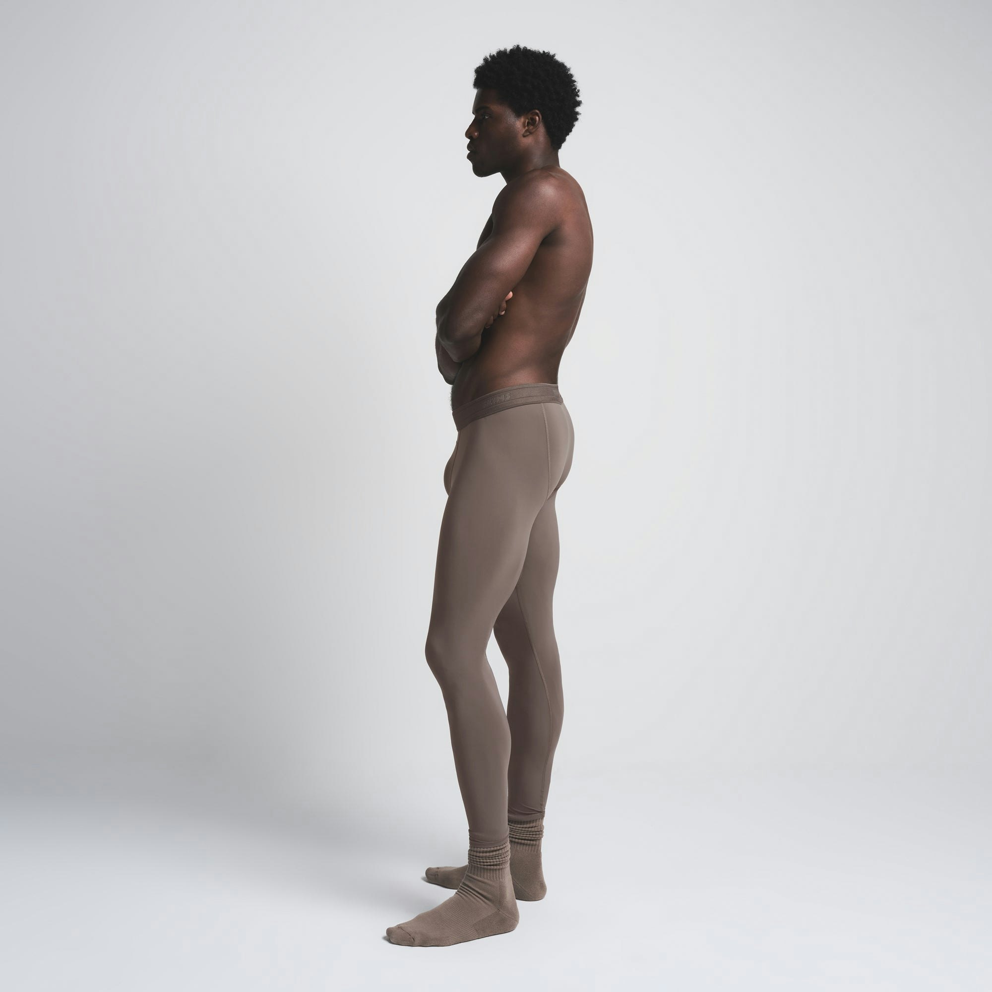 SKIMS SPORT MENS LEGGING | AMETHYST ON A MODEL SIDE VIEW