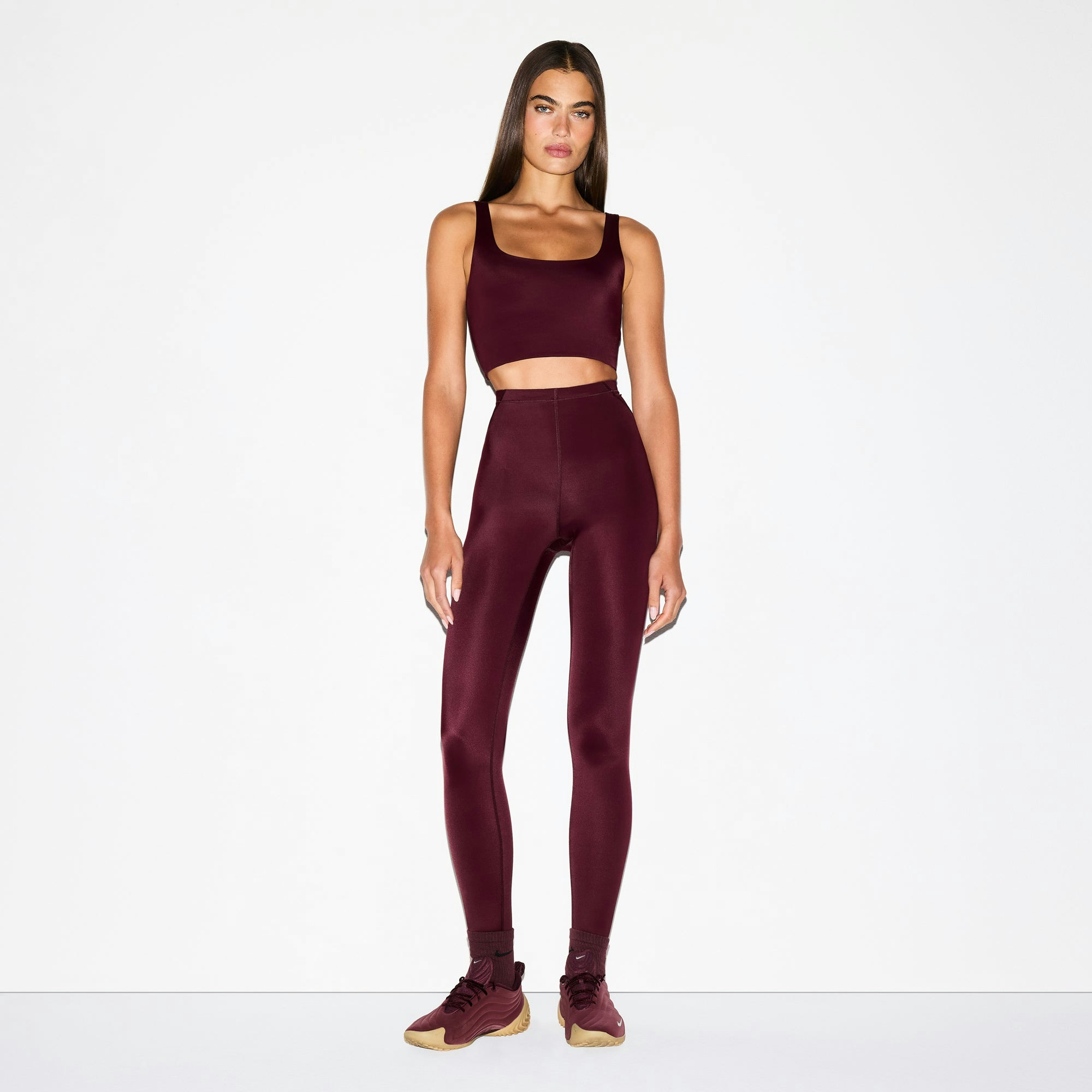 NikeSKIMS SHINE DRAWCORD 26" LEGGING | CURRANT ON A MODEL FRONT VIEW @ | FOCUS: 0.0, 1.0, 0.9