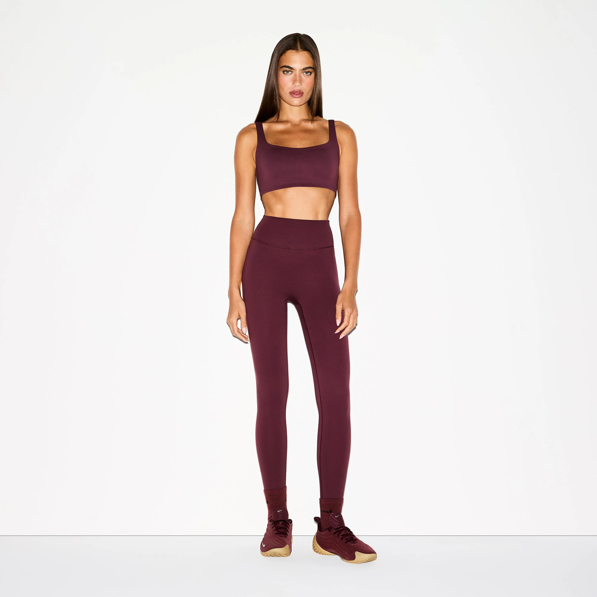 NikeSKIMS MATTE 26" LEGGING | CURRANT ON A MODEL FRONT VIEW @ | FOCUS: 0.0, 1.0, 0.9