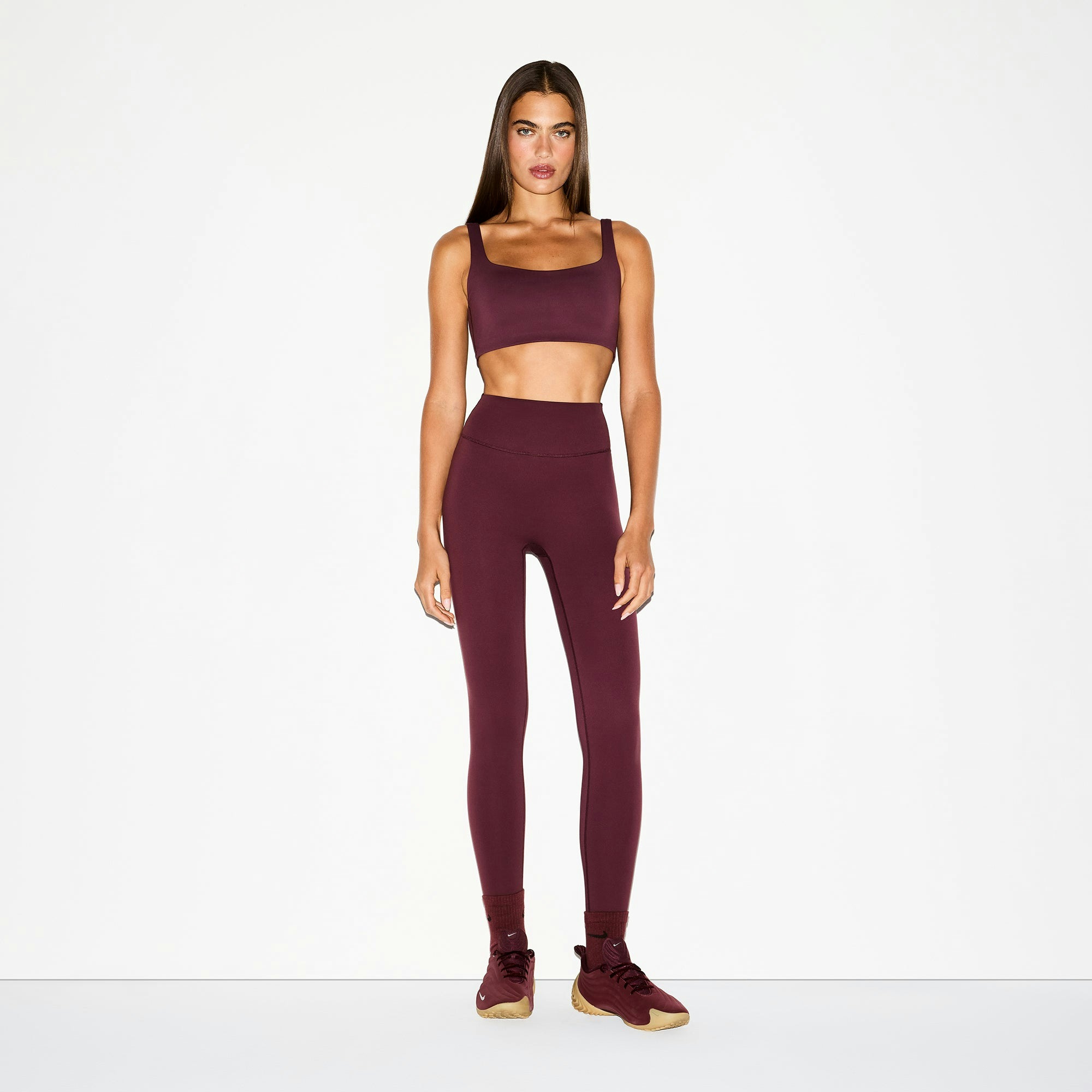 NikeSKIMS MATTE 26" LEGGING | CURRANT ON A MODEL FRONT VIEW @ | FOCUS: 0.0, 1.0, 0.9