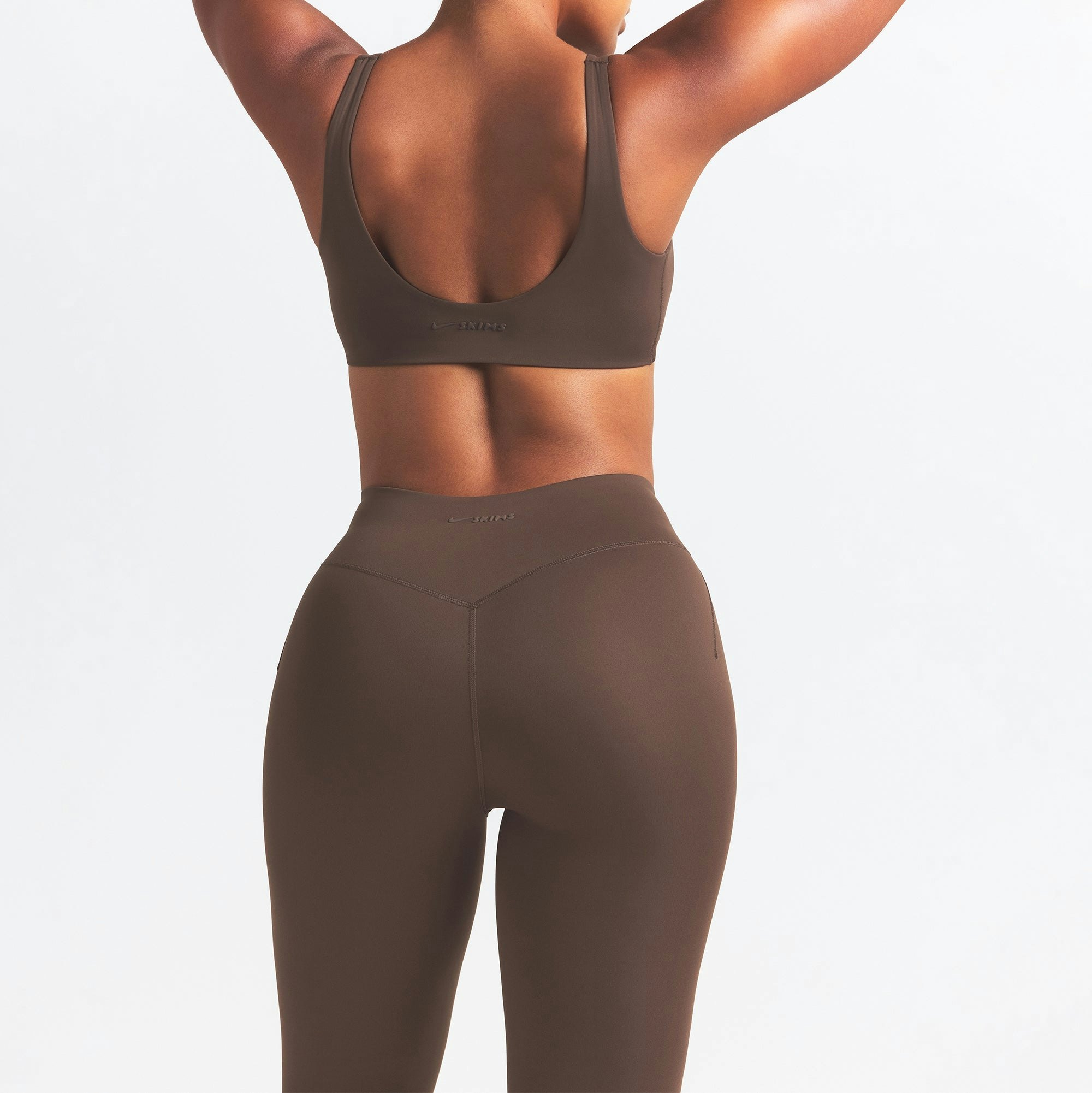 NikeSKIMS MATTE 26" LEGGING | DARK SEPIA ON A MODEL BACK VIEW