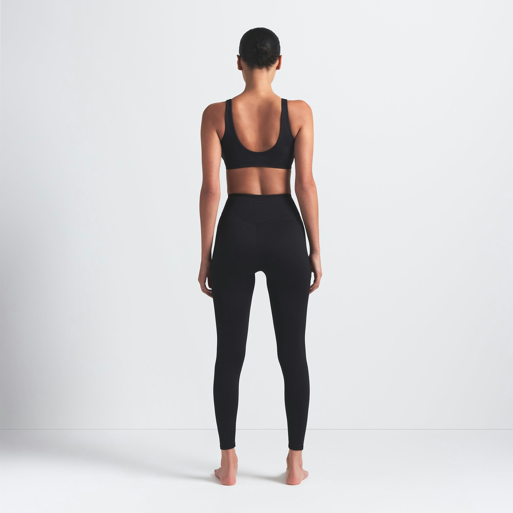 NikeSKIMS MATTE 26" LEGGING | OBSIDIAN ON A MODEL BACK VIEW