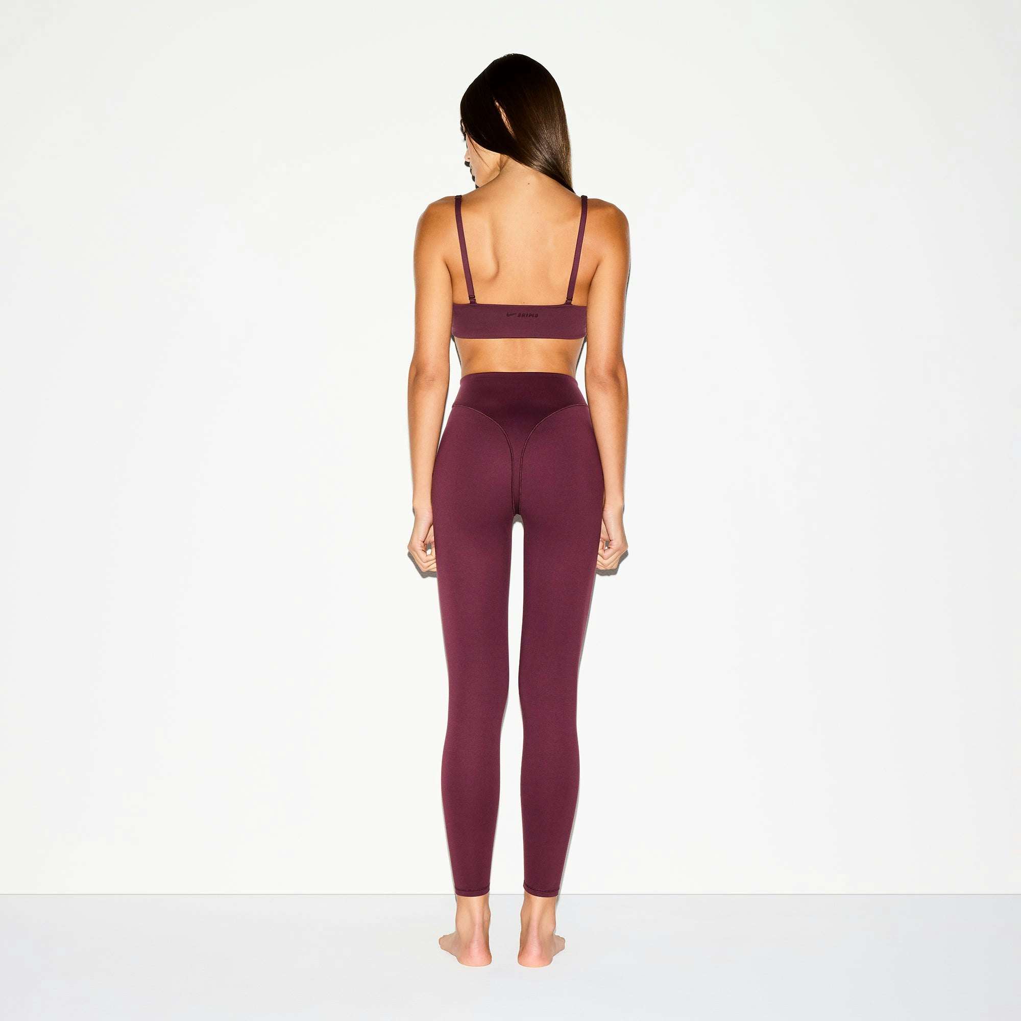NikeSKIMS MATTE V-LINE 26" LEGGING | CURRANT ON A MODEL BACK VIEW