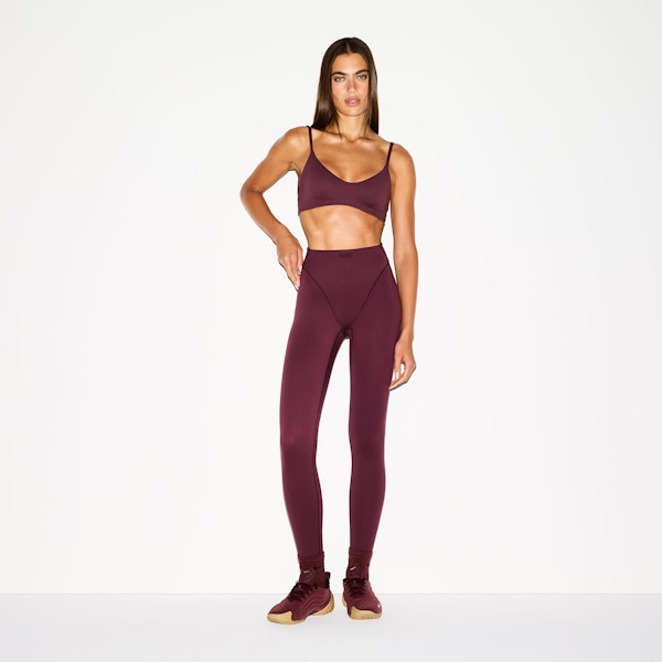 NikeSKIMS MATTE V-LINE 26" LEGGING | CURRANT ON A MODEL FRONT VIEW