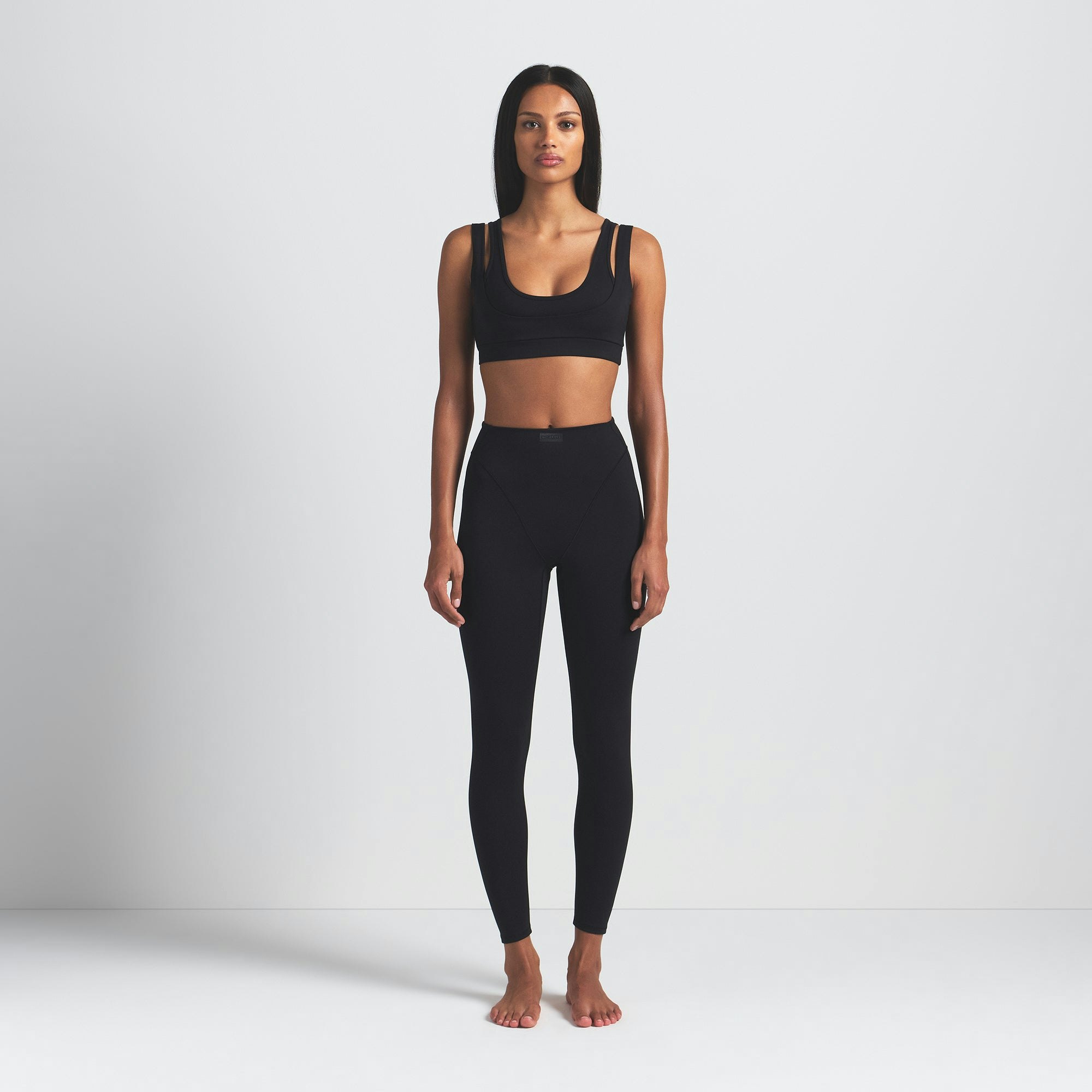 NikeSKIMS MATTE V-LINE 26" LEGGING | OBSIDIAN ON A MODEL FRONT VIEW