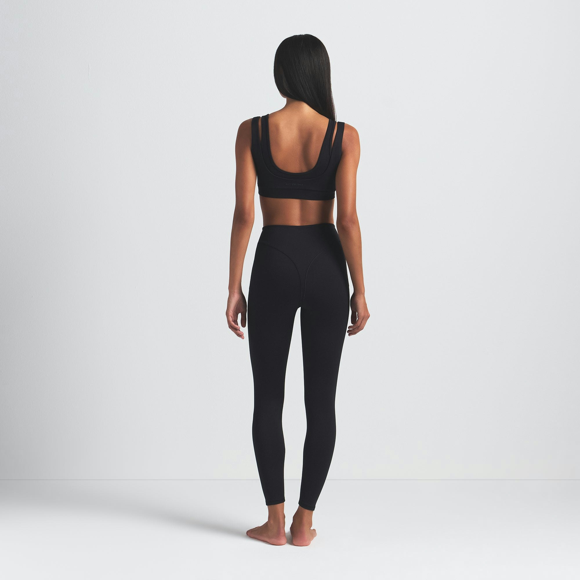 NikeSKIMS MATTE V-LINE 26" LEGGING | OBSIDIAN ON A MODEL BACK VIEW