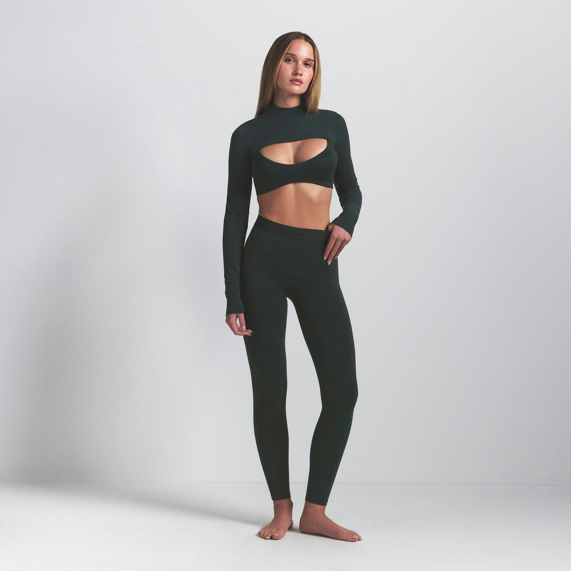 NikeSKIMS VINTAGE SEAMLESS 26" LEGGING | DARK TEAL ON A MODEL FRONT VIEW