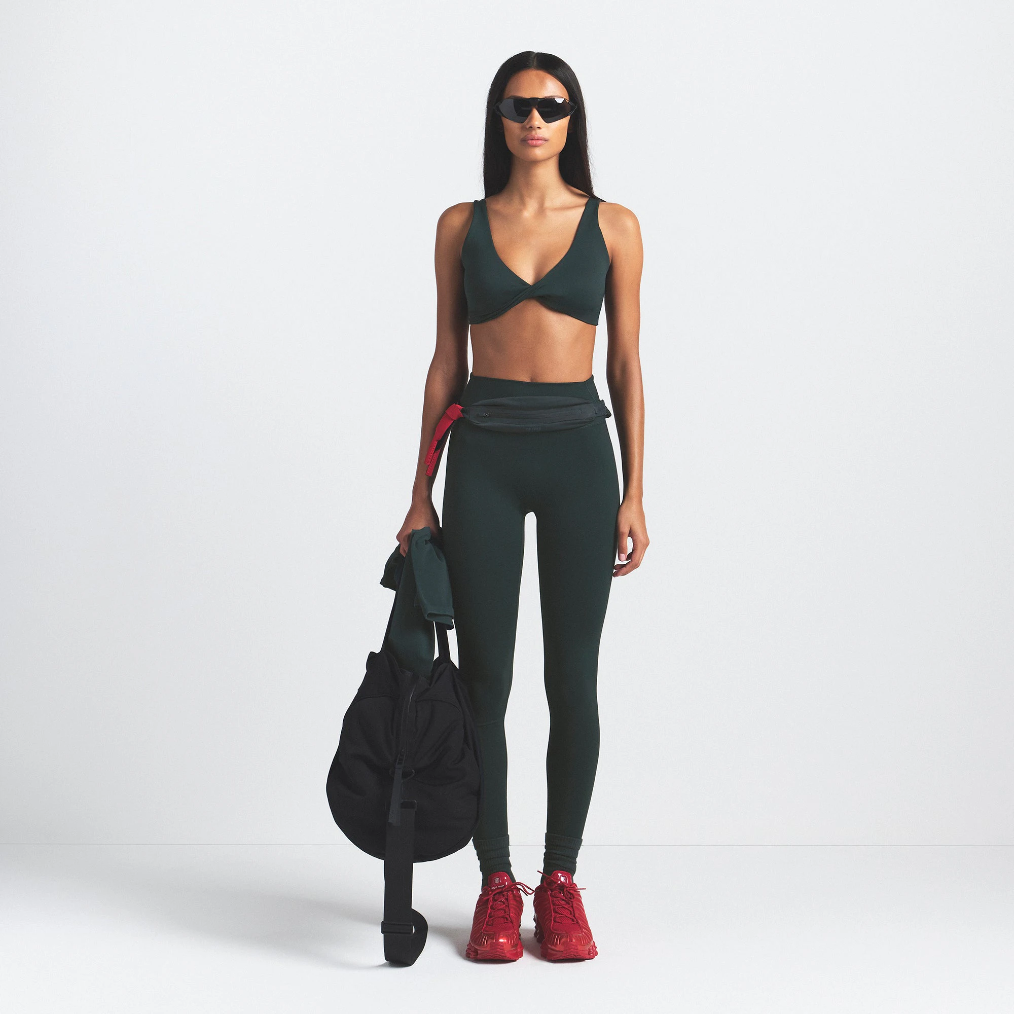 NikeSKIMS MATTE 29" LEGGING | DARK TEAL ON A MODEL FRONT VIEW @ | FOCUS: 0.0, 1.0, 0.9