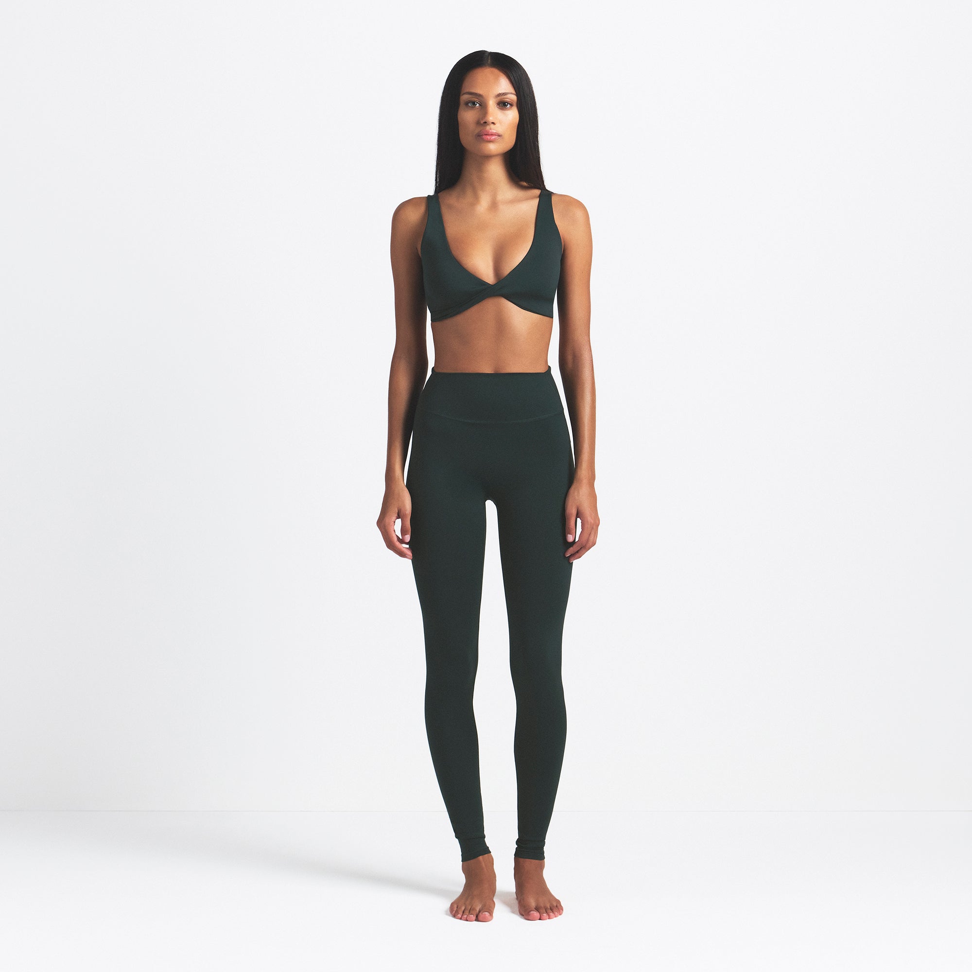 NikeSKIMS MATTE 29" LEGGING | DARK TEAL ON A MODEL FRONT VIEW @ | FOCUS: 0.0, 1.0, 0.9