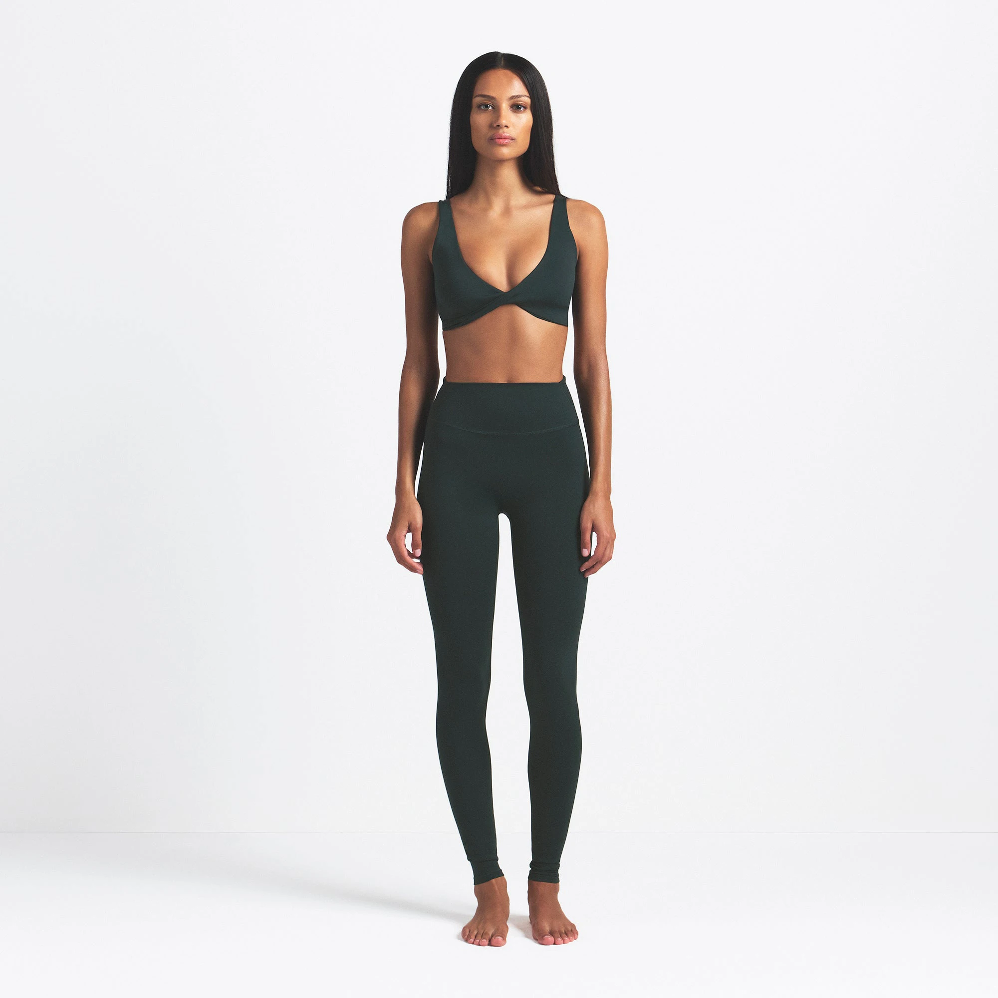 NikeSKIMS MATTE 29" LEGGING | DARK TEAL ON A MODEL FRONT VIEW @ | FOCUS: 0.0, 1.0, 0.9