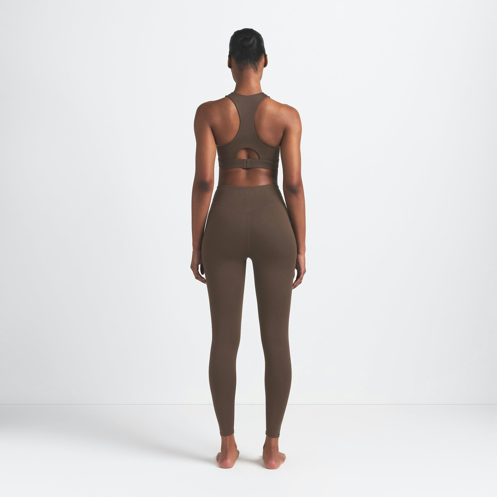 NikeSKIMS MATTE 29" LEGGING | DARK SEPIA ON A MODEL BACK VIEW