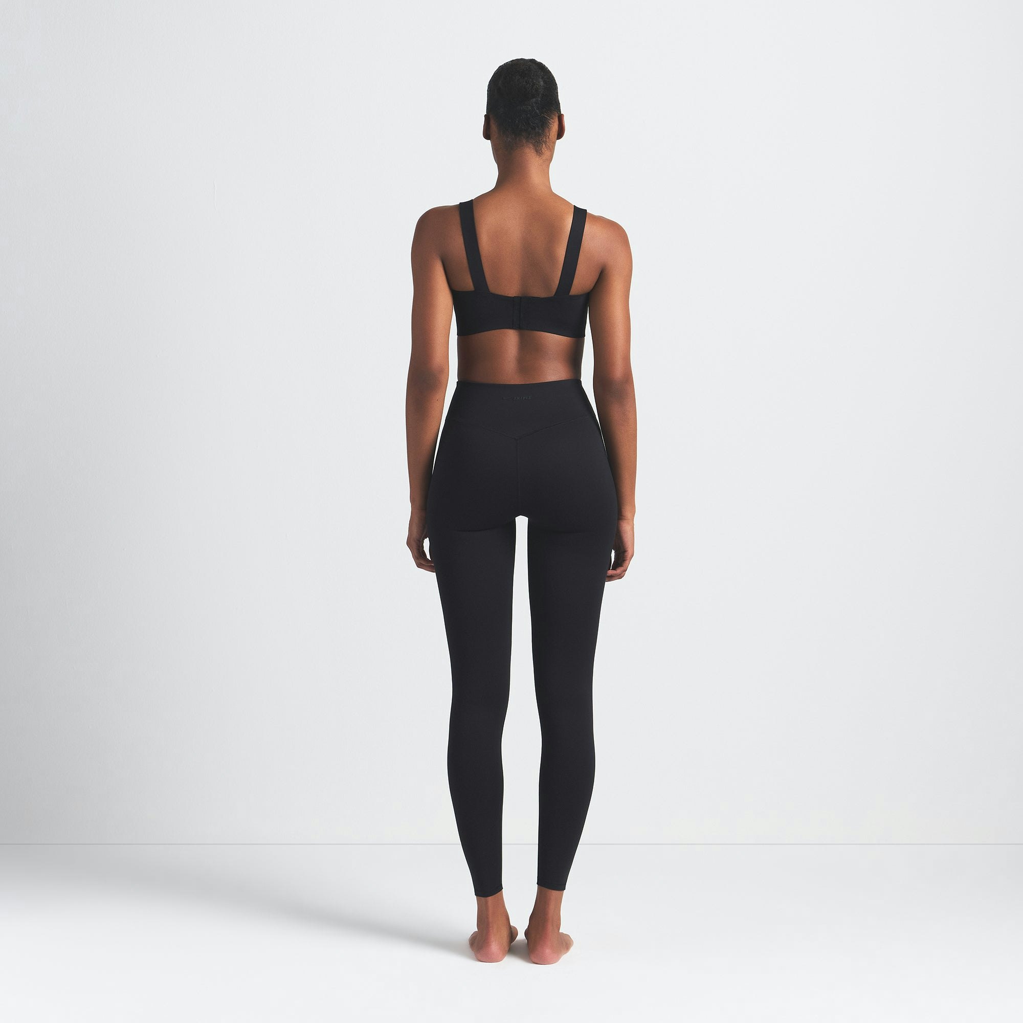 NikeSKIMS MATTE 29" LEGGING | OBSIDIAN ON A MODEL BACK VIEW