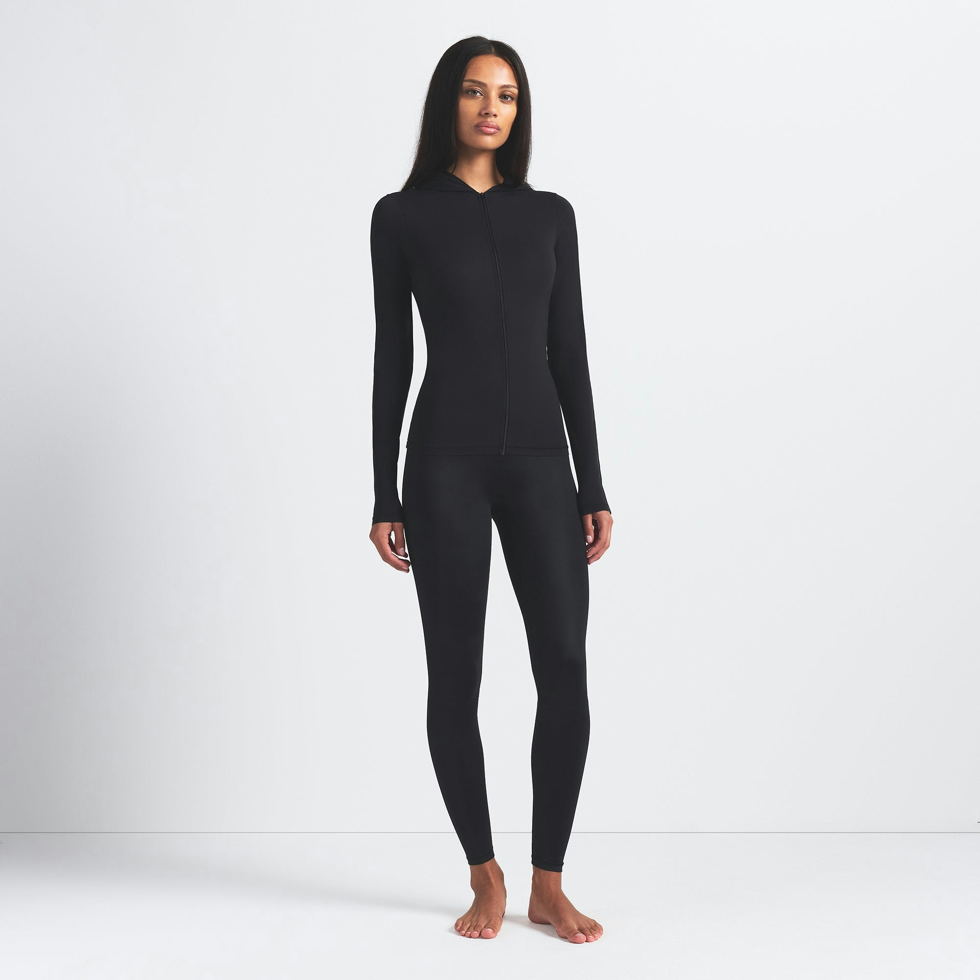 NikeSKIMS SHINE BONDED WAIST 26" LEGGING | OBSIDIAN ON A MODEL FRONT VIEW