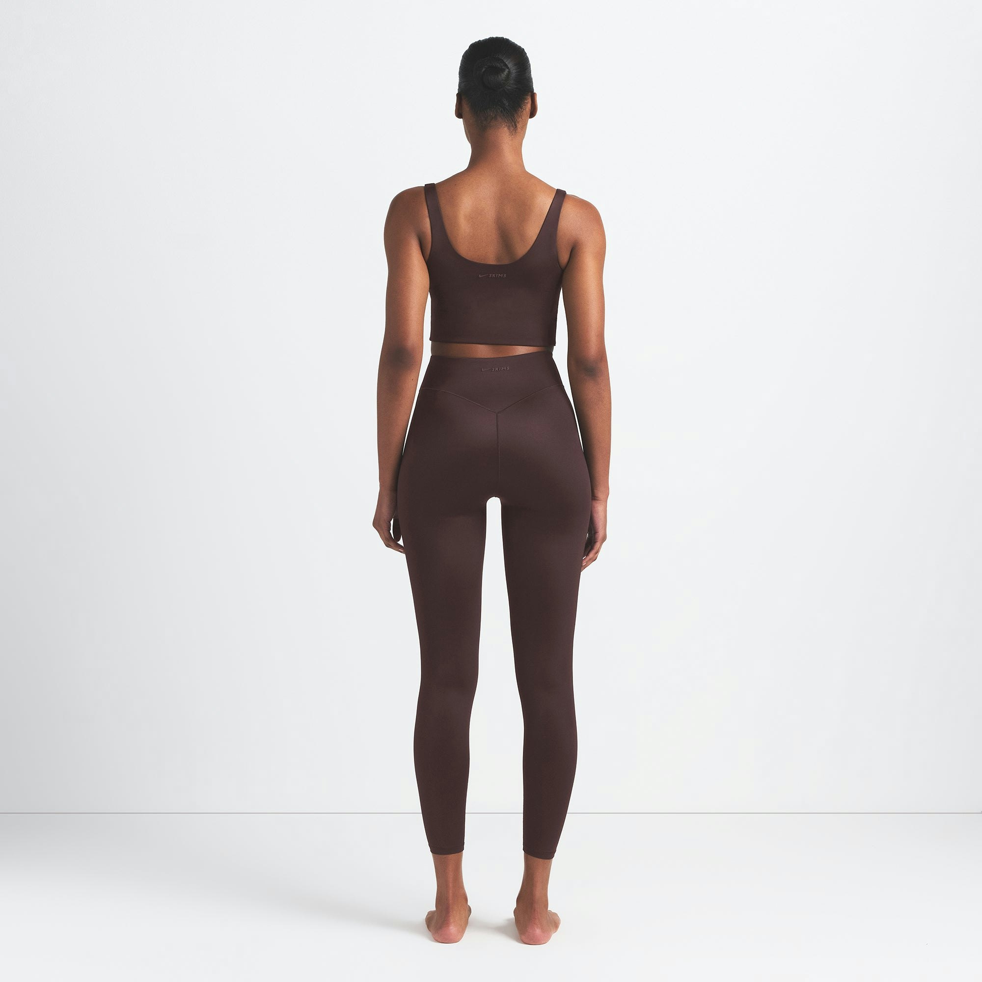 NikeSKIMS SHINE BONDED WAIST 26" LEGGING | PHOENIX ON A MODEL FRONT VIEW