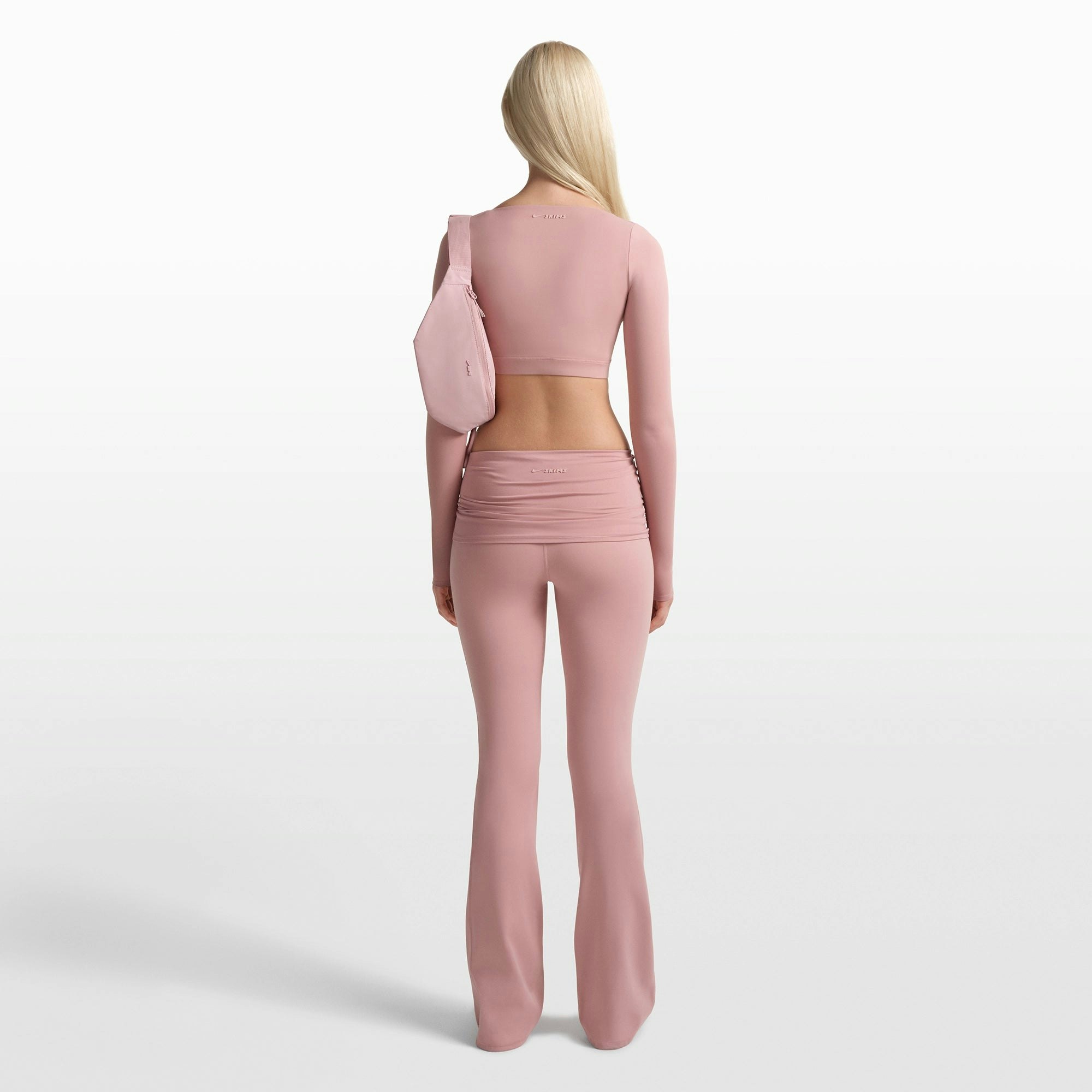 NikeSKIMS MATTE FOLDOVER SLIM FLARE LEGGING | HIMALAYAN ON A MODEL FRONT VIEW @ | FOCUS: 0.0, 1.0, 0.9