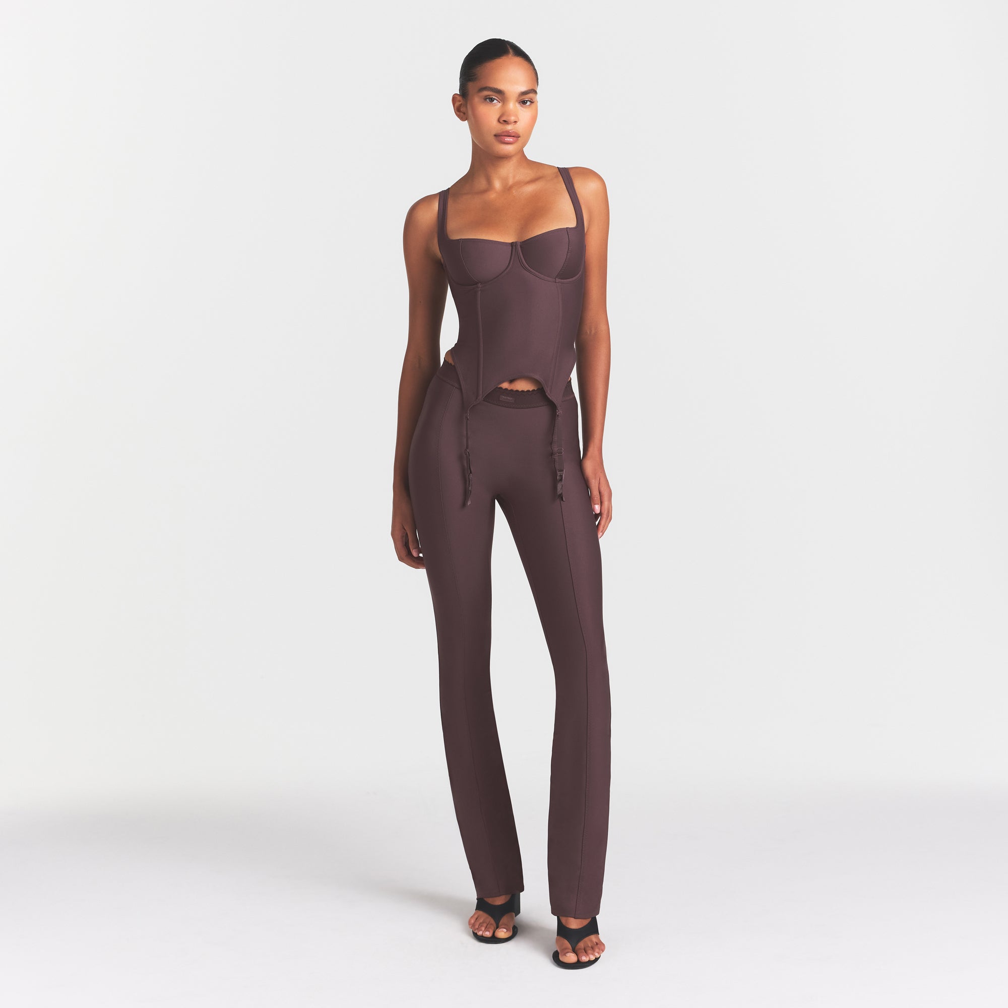 SKIMS BODY HIGH-WAISTED FLARE PANT | RAISIN ON A MODEL FRONT VIEW @ | FOCUS: 0.0, 1.0, 0.9
