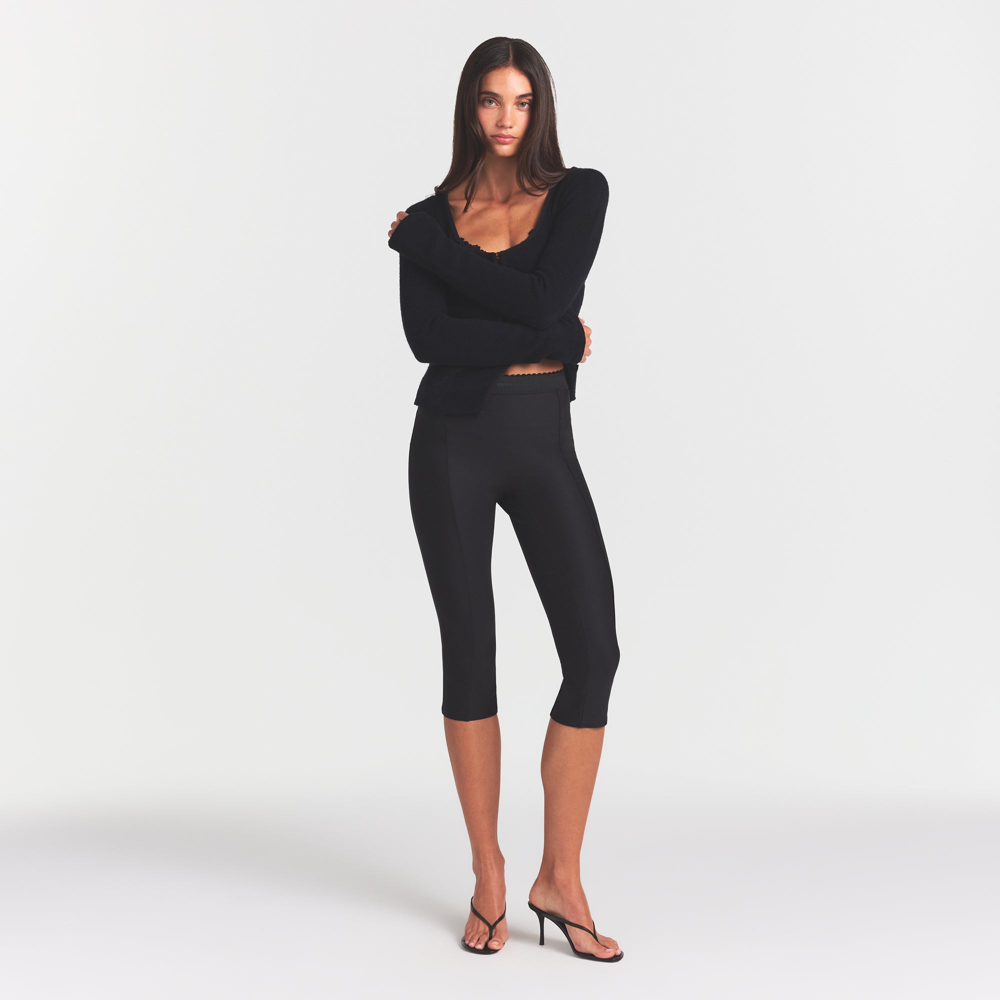 SKIMS BODY HIGH-WAISTED CAPRI | ONYX ON A MODEL FRONT VIEW @ | FOCUS: 0.0, 1.0, 0.9