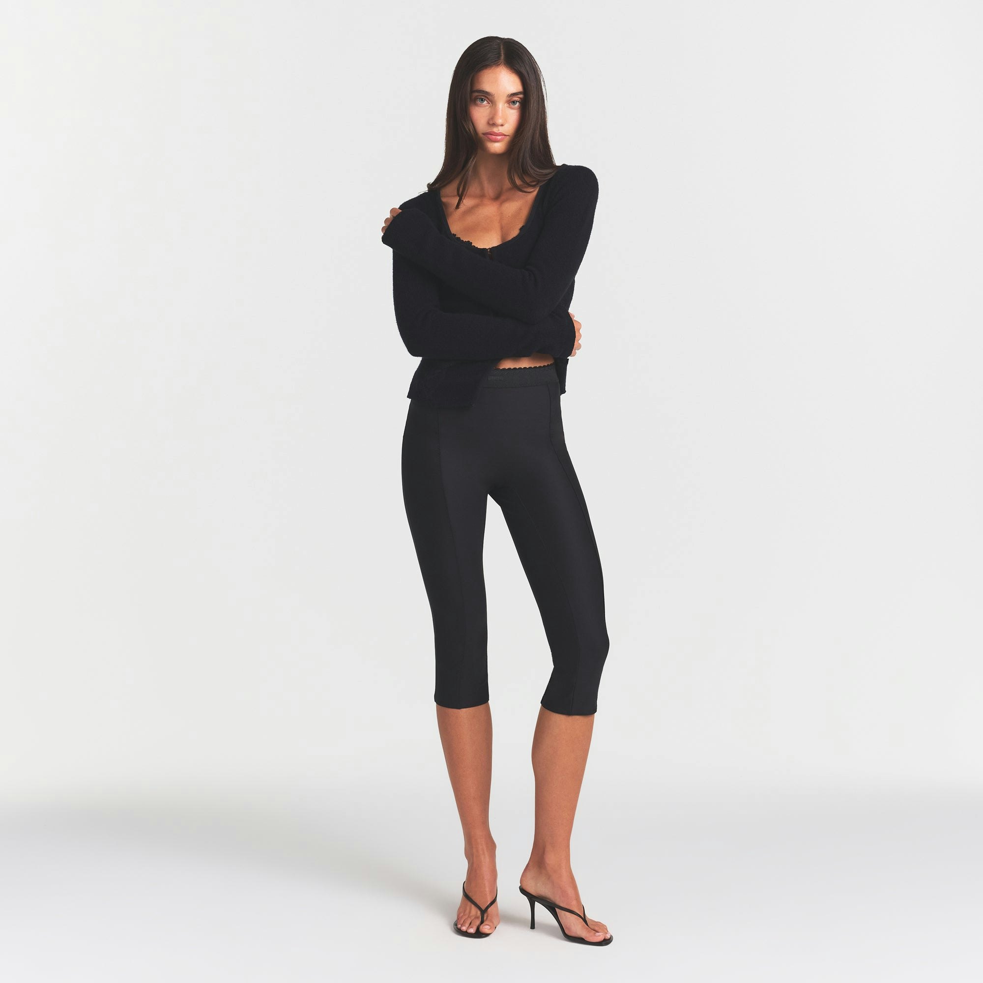 SKIMS BODY HIGH-WAISTED CAPRI | ONYX ON A MODEL FRONT VIEW @ | FOCUS: 0.0, 1.0, 0.9