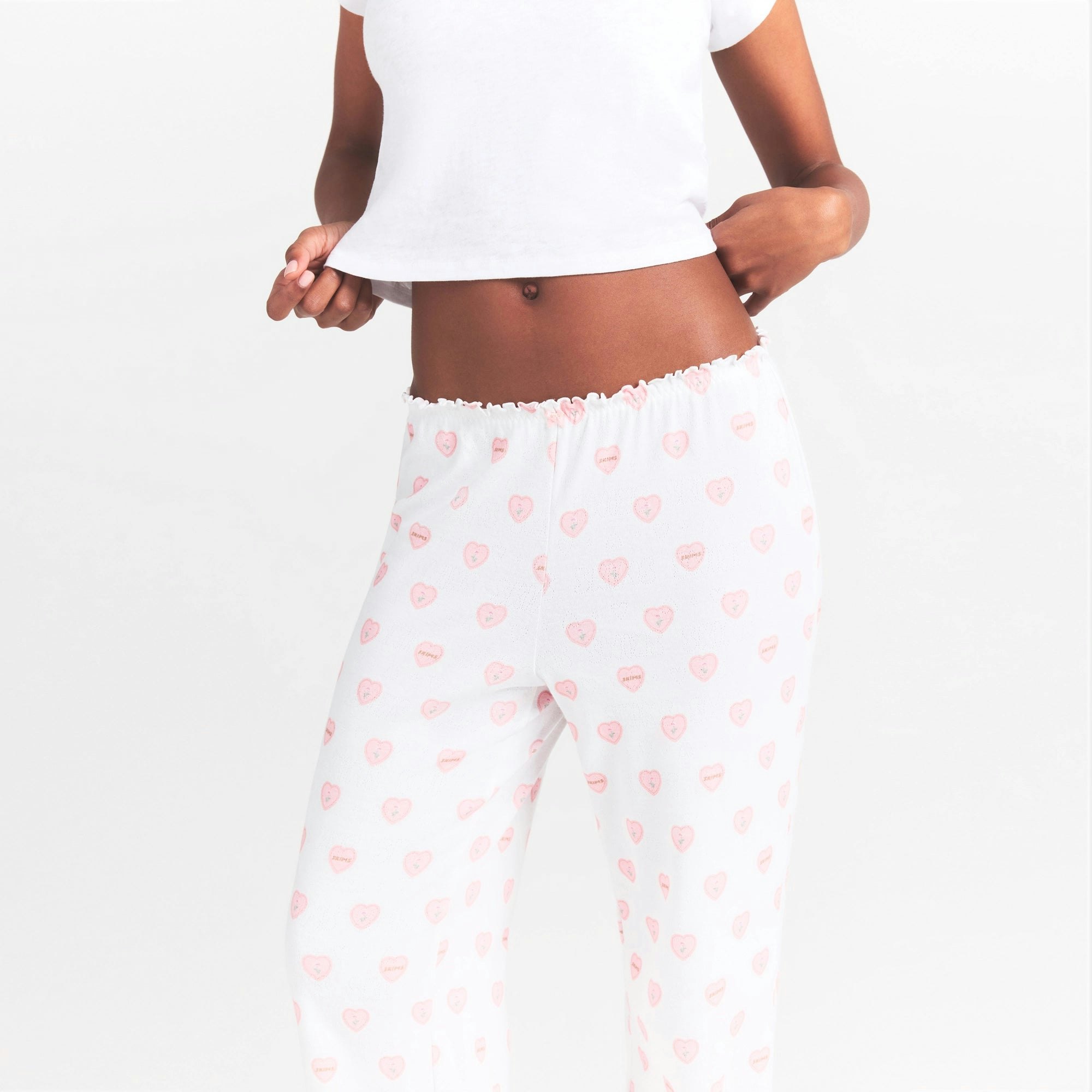 LOGO POINTELLE STRAIGHT LEG PANT | SNOW LACE HEARTS ON A MODEL SIDE VIEW @ | FOCUS: 0.0, 1.0, 0.9