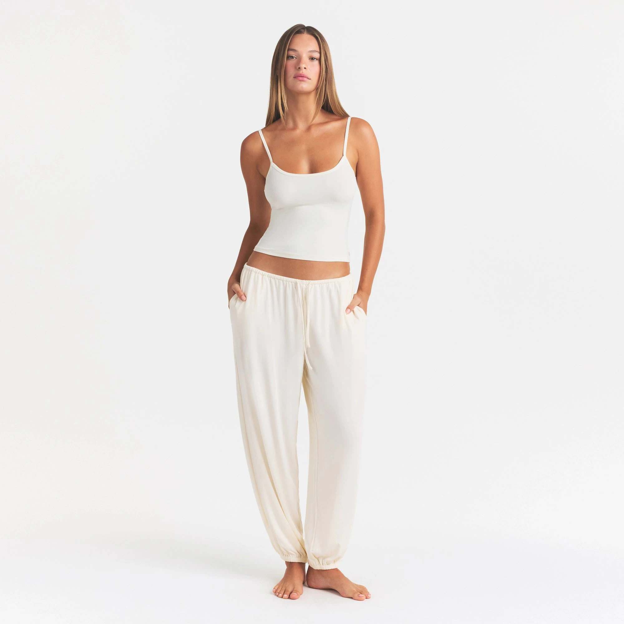 SKIMS SLEEP JOGGER | ECRU ON A MODEL FRONT VIEW @ | FOCUS: 0.0, 1.0, 0.9