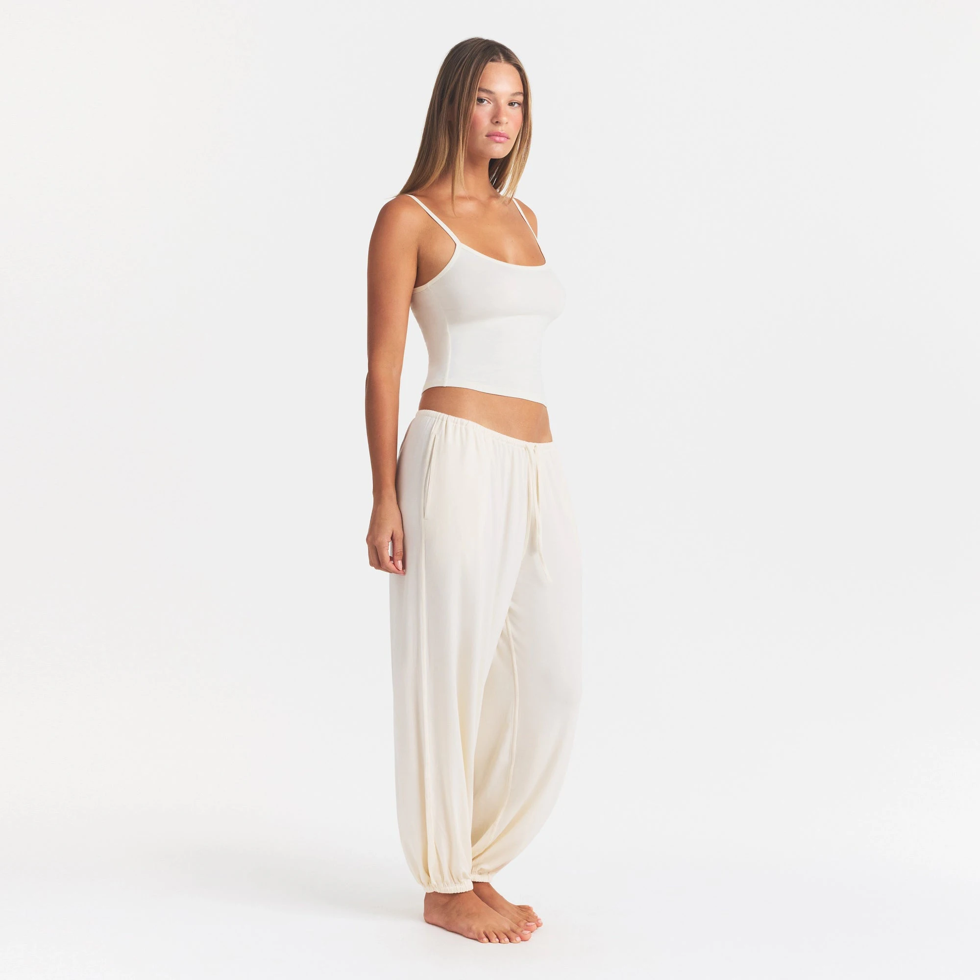 SKIMS SLEEP JOGGER | ECRU ON A MODEL FRONT VIEW @ | FOCUS: 0.0, 1.0, 0.9