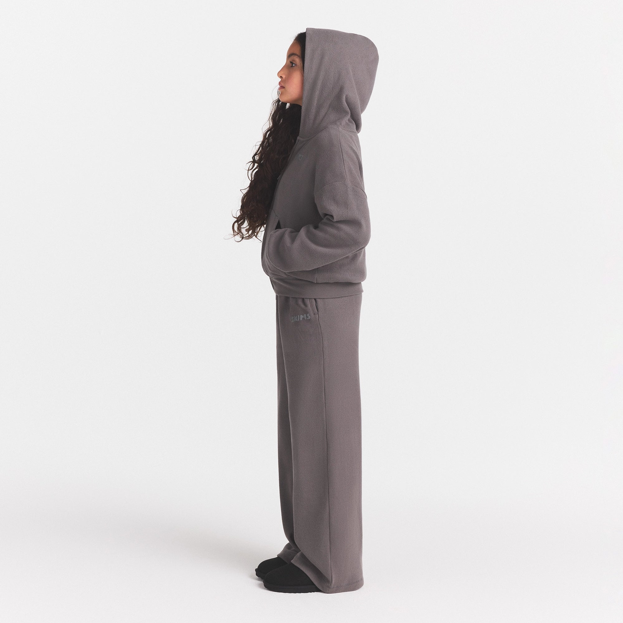 KIDS COZY WAFFLE WIDE LEG PANT | WASHED GUNMETAL ON A MODEL SIDE VIEW @ | FOCUS: 0.0, 1.0, 0.9