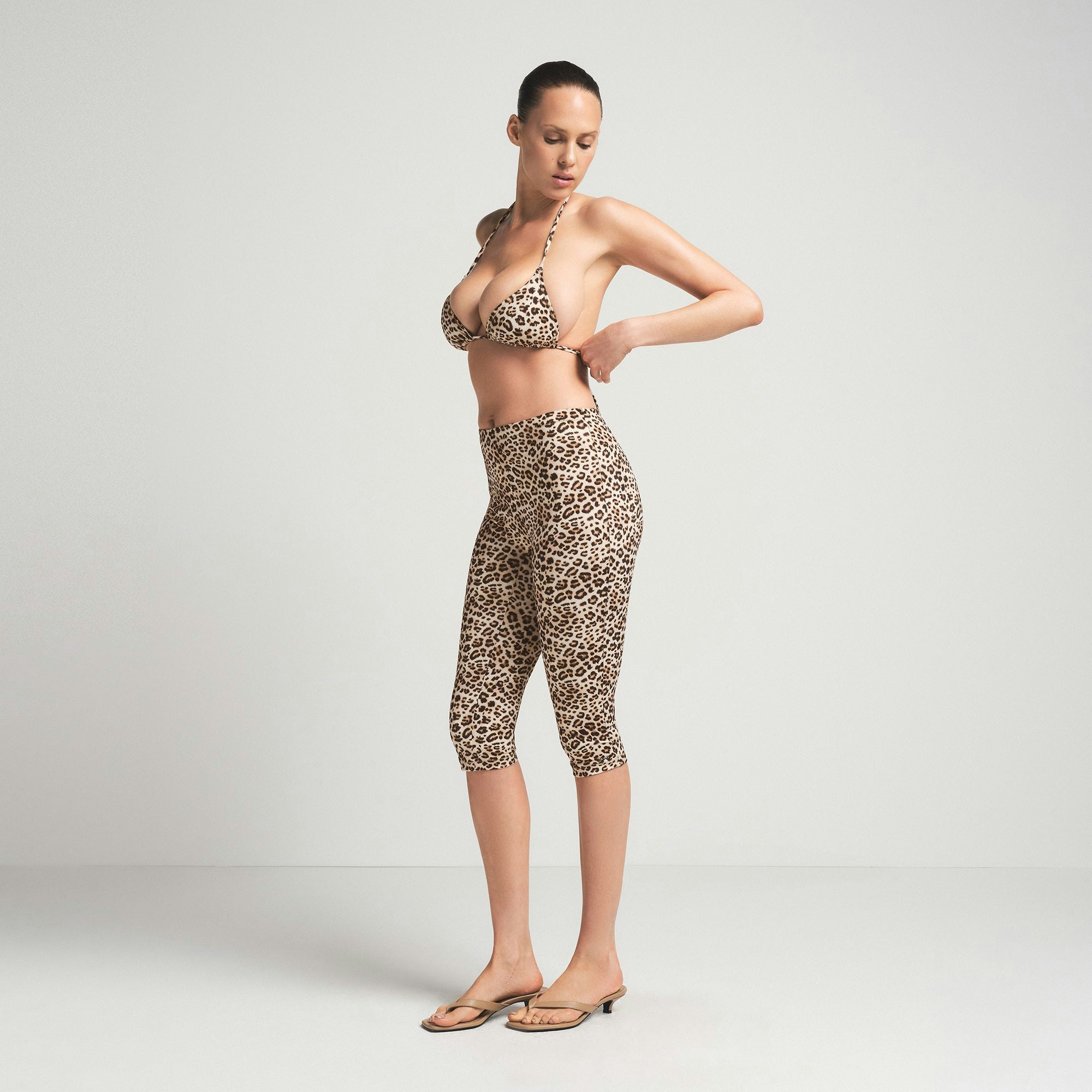 SIGNATURE SWIM CAPRI | CHAMPAGNE LEOPARD PRINT ON A MODEL SIDE VIEW | FOCUS: 0.0, 1.0, 0.9